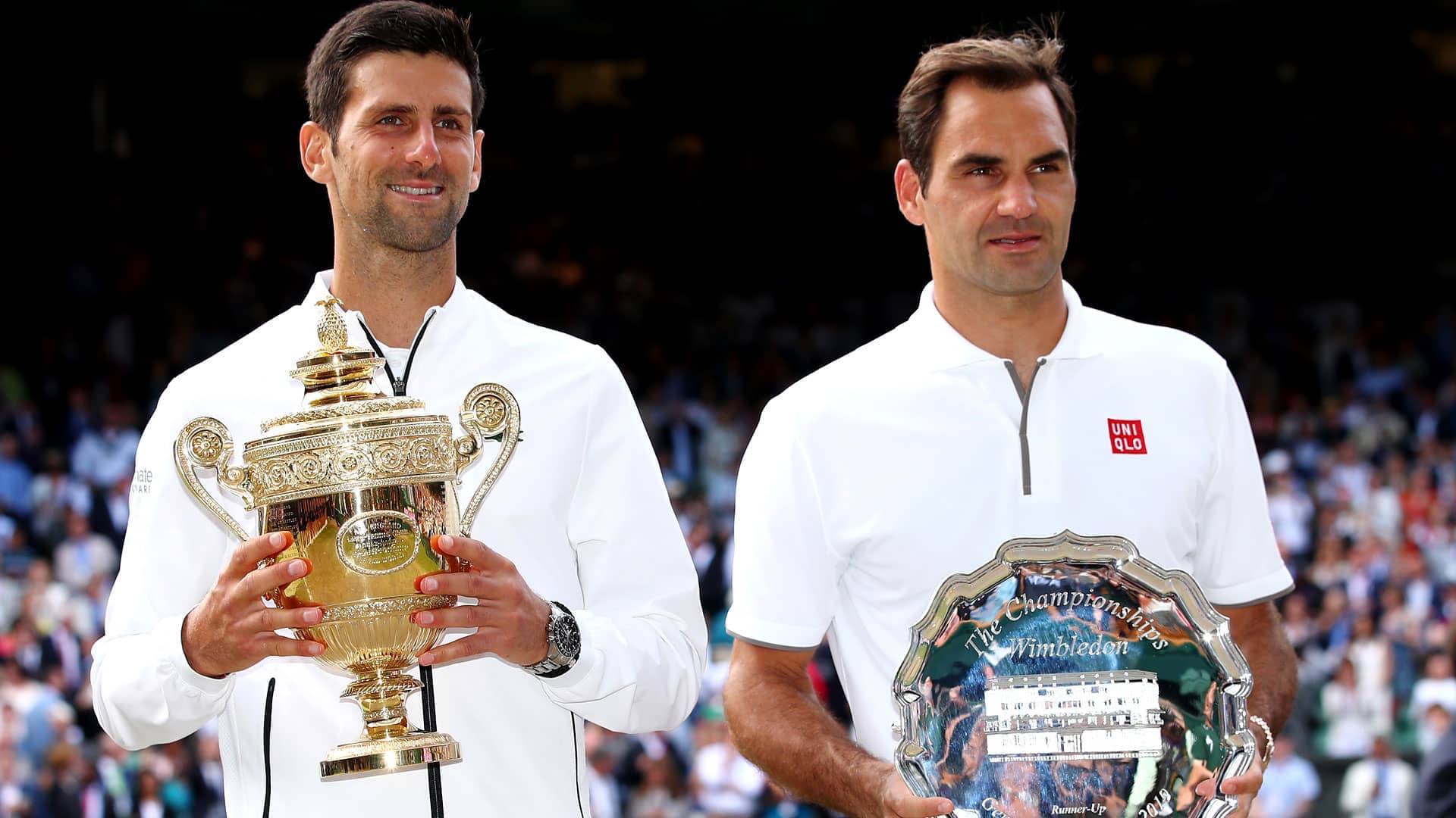 Novak Djokovic celebrates beating Roger Federer 13-12(3) in the deciding set of the 2019 final at The Championships, Wimbledon.