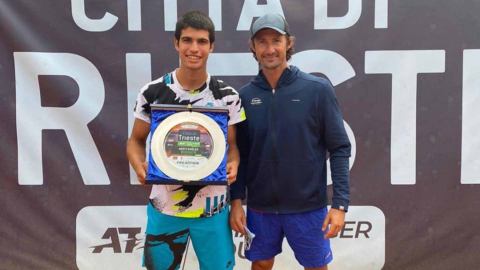 Carlos Alcaraz celebrates his first ATP Challenger Tour title with coach and former World No. 1 Juan Carlos Ferrero.