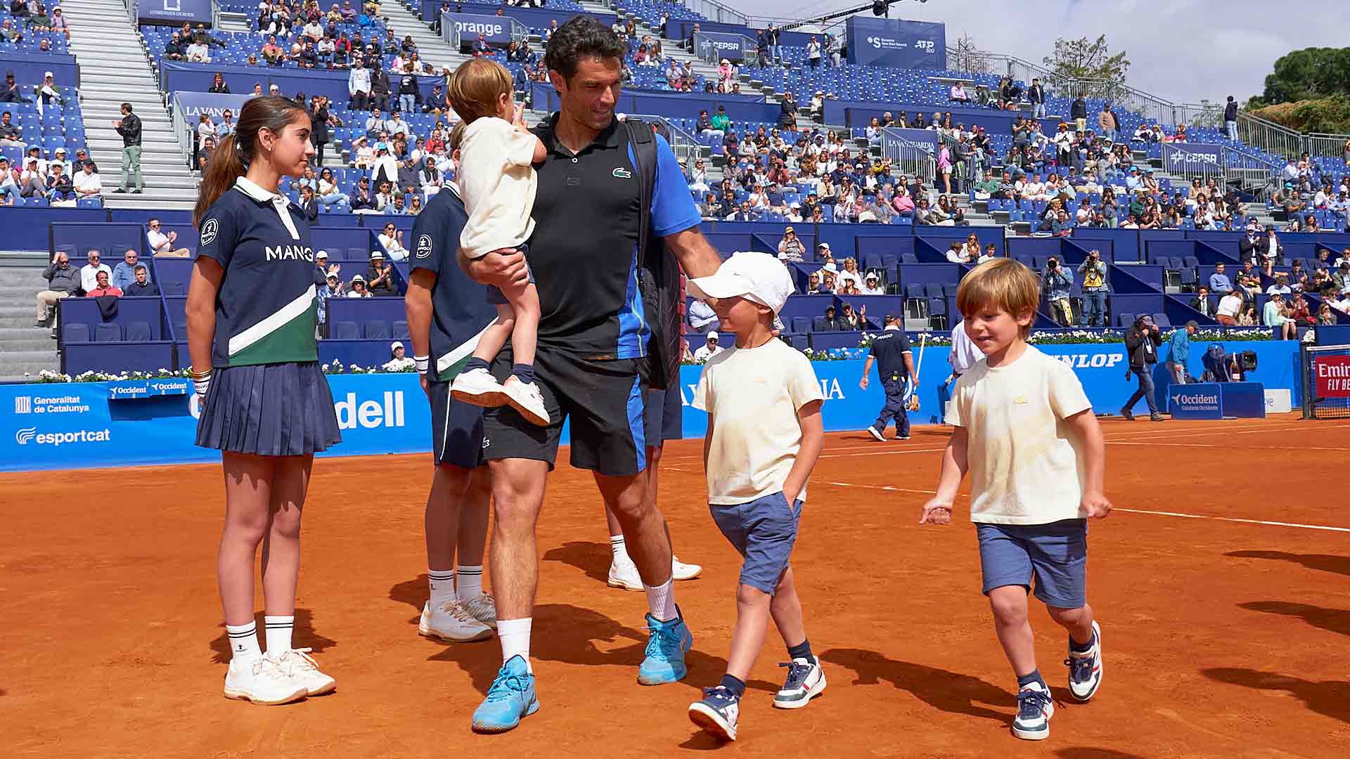 Pablo Andujar is surrounded by his family for his final match at the Barcelona Open Banc Sabadell on Monday.