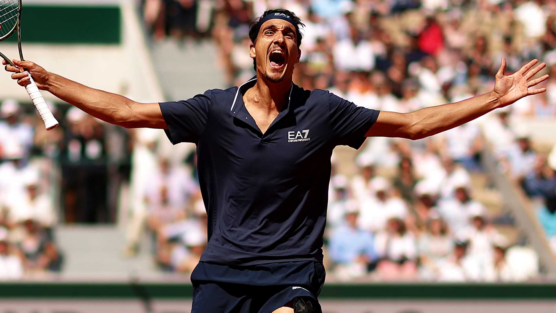 Lorenzo Sonego celebrates earning his sixth Top 10 win on Friday at Roland Garros.
