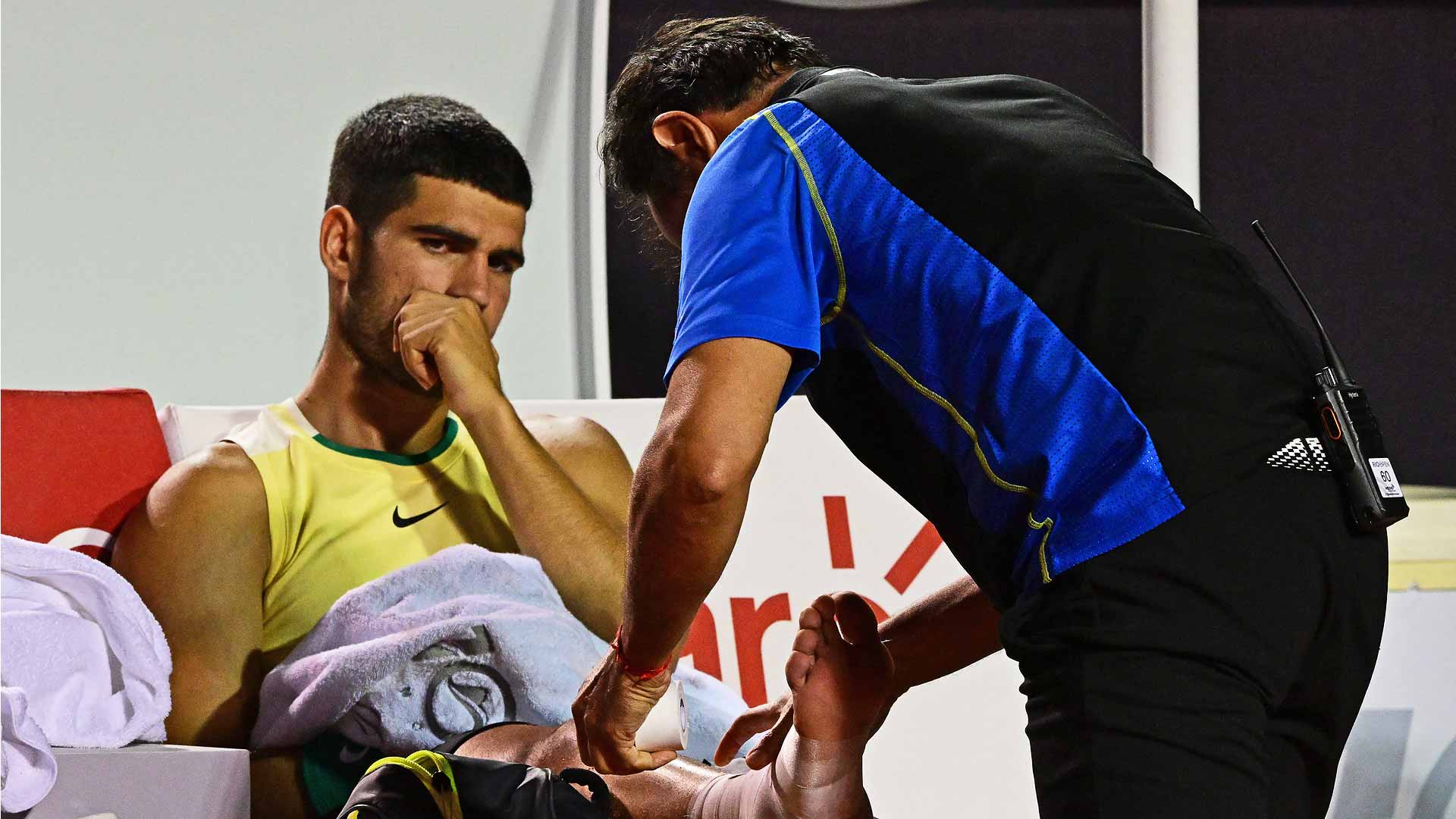 Carlos Alcaraz receives treatment from an ATP physiotherapist after hurting his ankle against Thiago Monteiro Tuesday in Rio de Janeiro.
