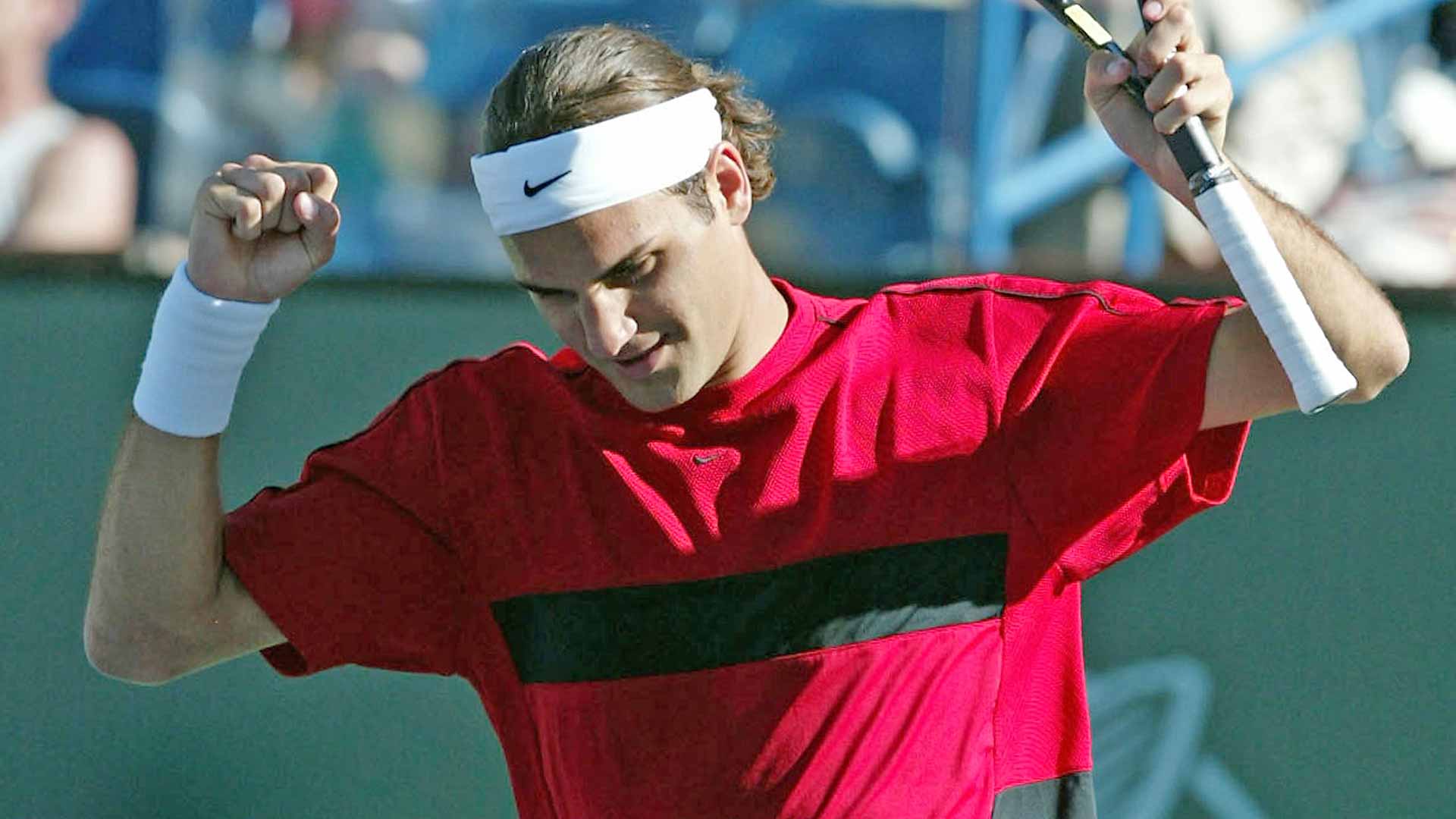 Roger Federer celebrates after beating Tim Henman to win his maiden BNP Paribas Open crown.