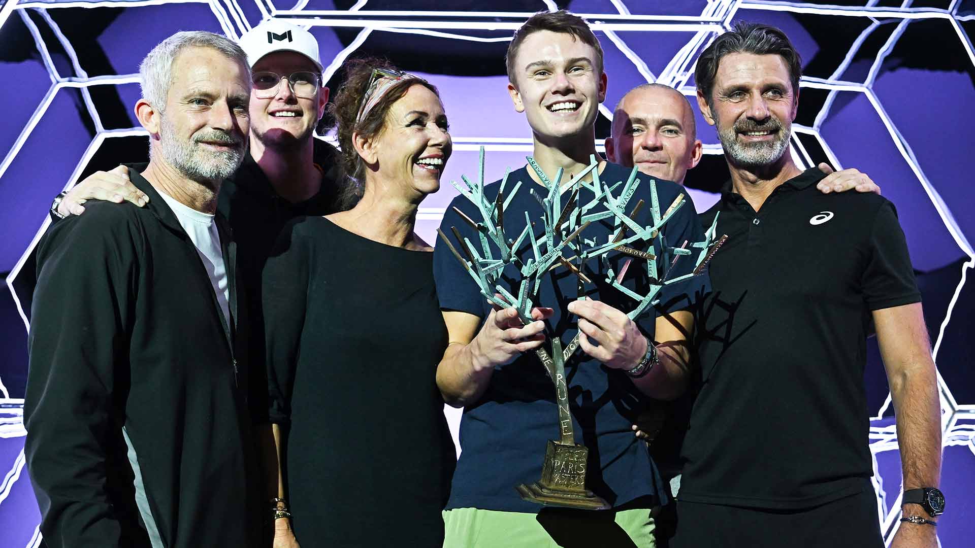 Holger Rune celebrates his Paris triumph with his team.