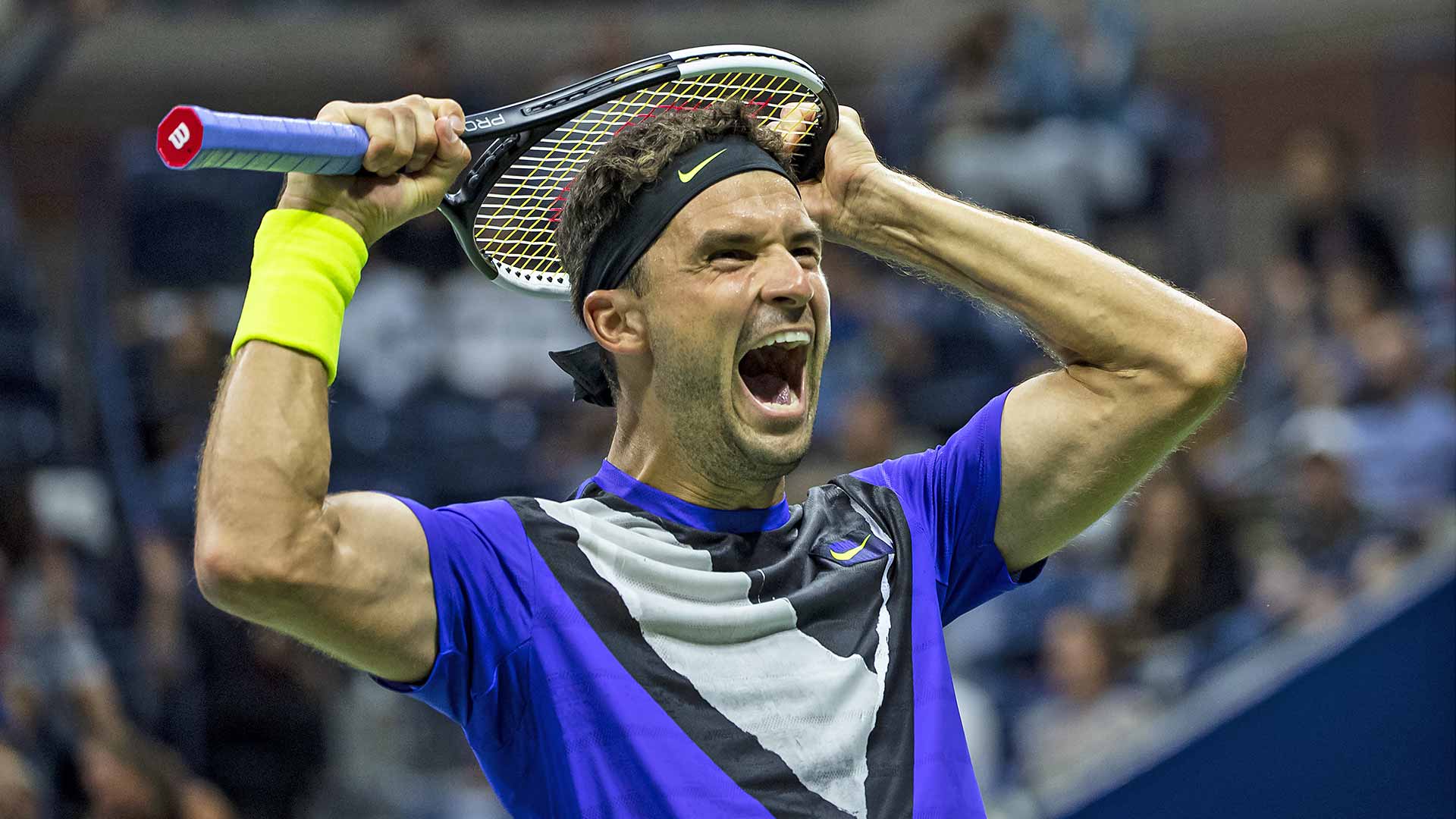 Grigor Dimitrov celebrates his first win over Roger Federer in the US Open quarter-finals.