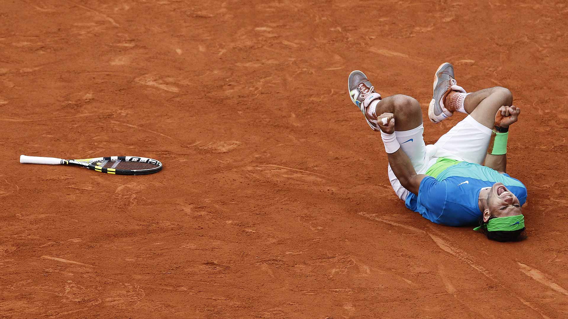 Rafael Nadal reacts to winning his 5th Roland Garros title in 2010 after defeating Robin Soderling
