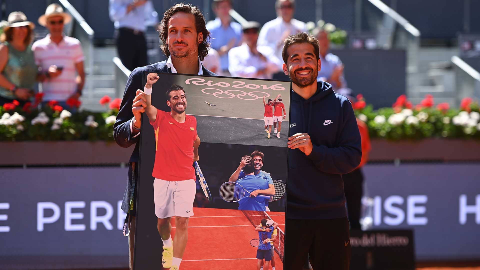 Feliciano Lopez and Marc Lopez celebrate the 39-year-old's career on court in Madrid.
