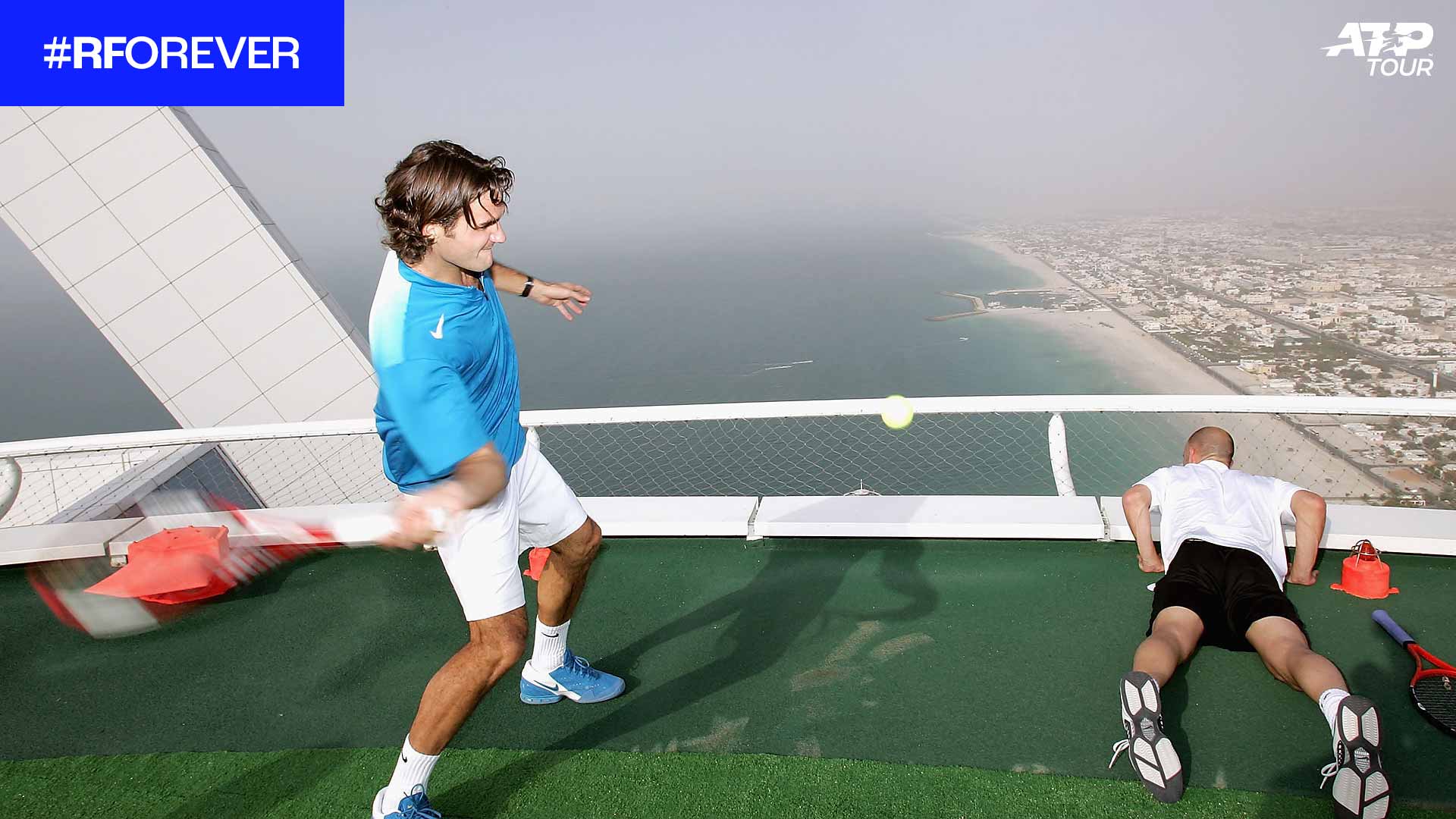 Roger Federer has some fun with Andre Agassi on the Burj Al Arab helipad in 2005.