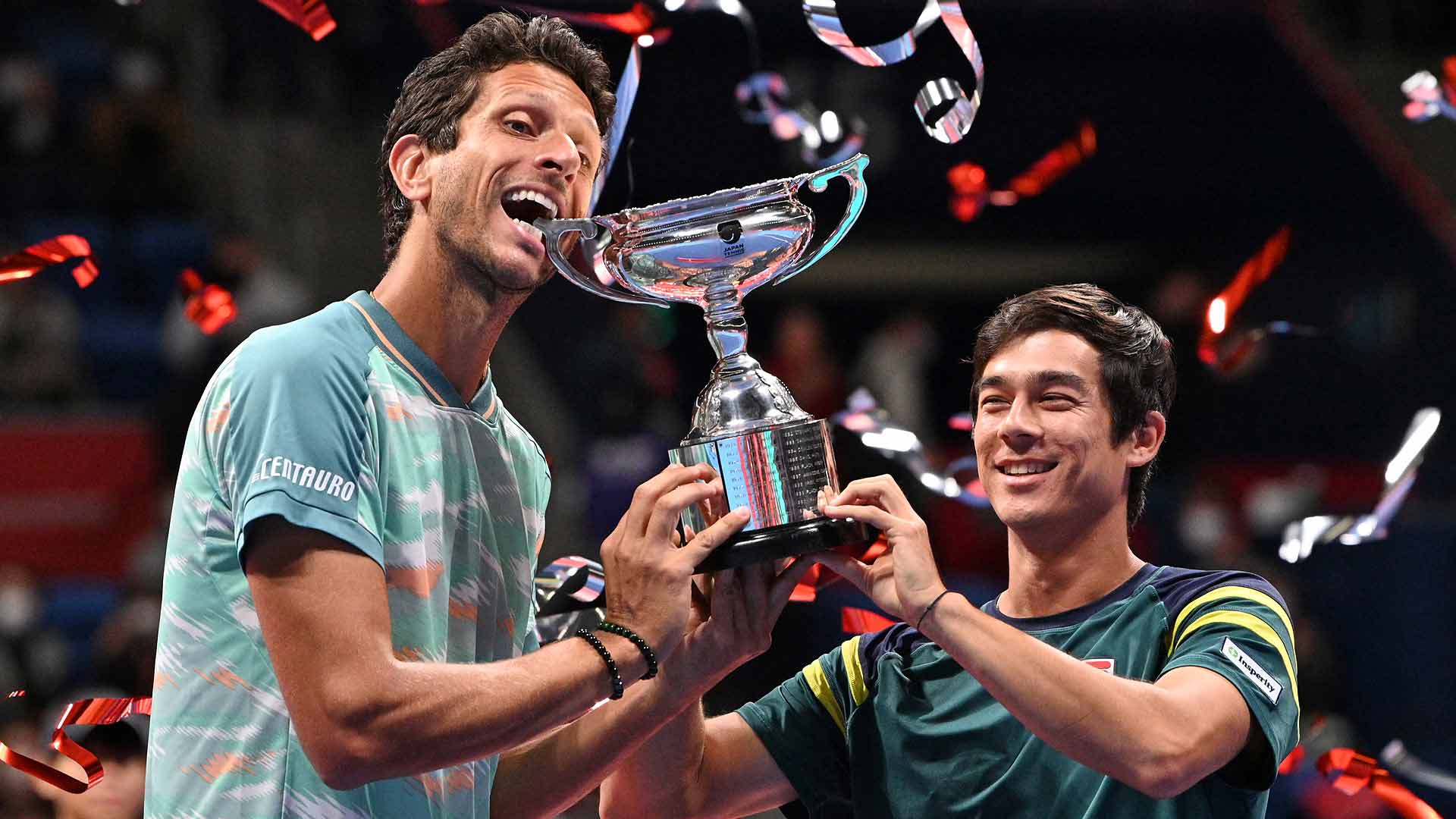 Marcelo Melo and Mackenzie McDonald celebrate winning the title Sunday at the Rakuten Japan Open Tennis Championships.
