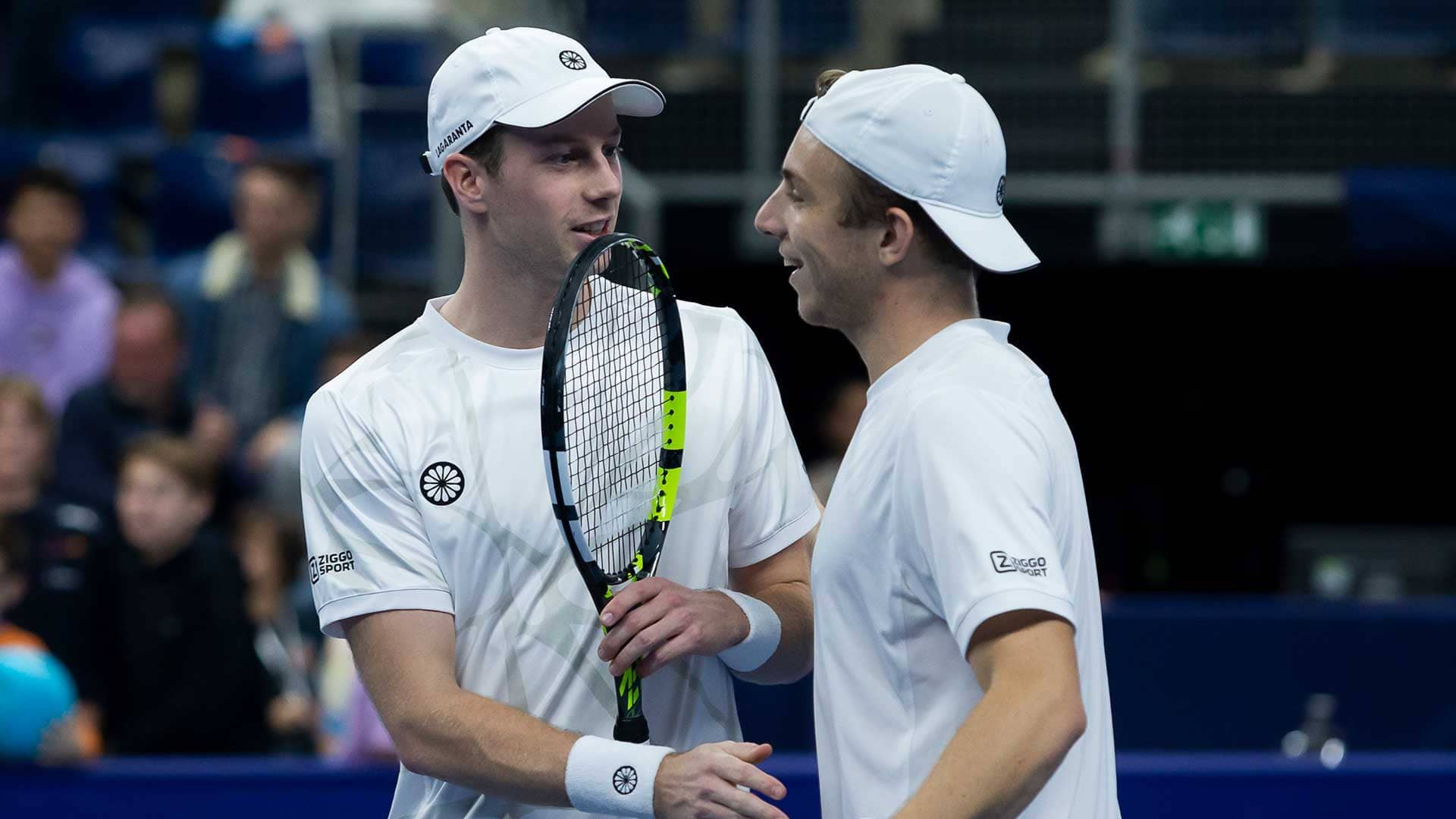 Botic van de Zandschulp and Tallon Griekspoor celebrate in Antwerp on Sunday.