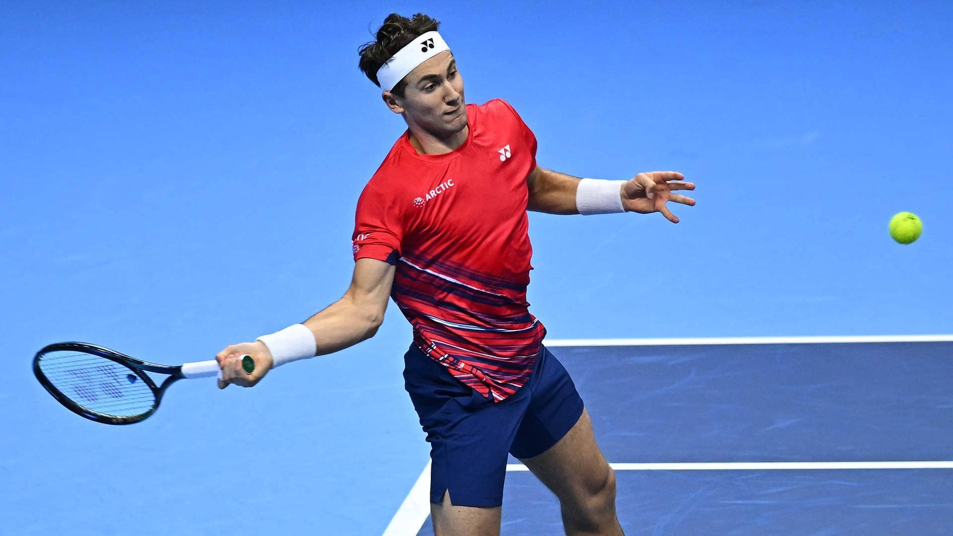Casper Ruud fires a forehand against Taylor Fritz on Tuesday in the pair's Green Group clash at the Nitto ATP Finals in Turin.