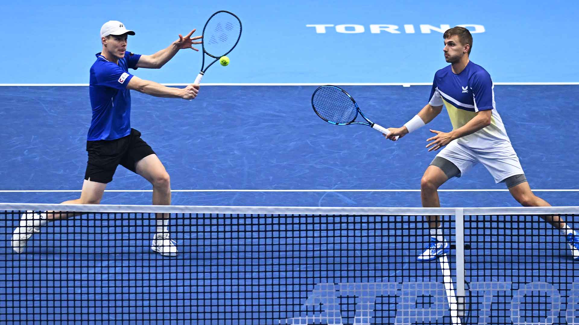 Harri Heliovaara and Lloyd Glasspool in action on Thursday in Turin.