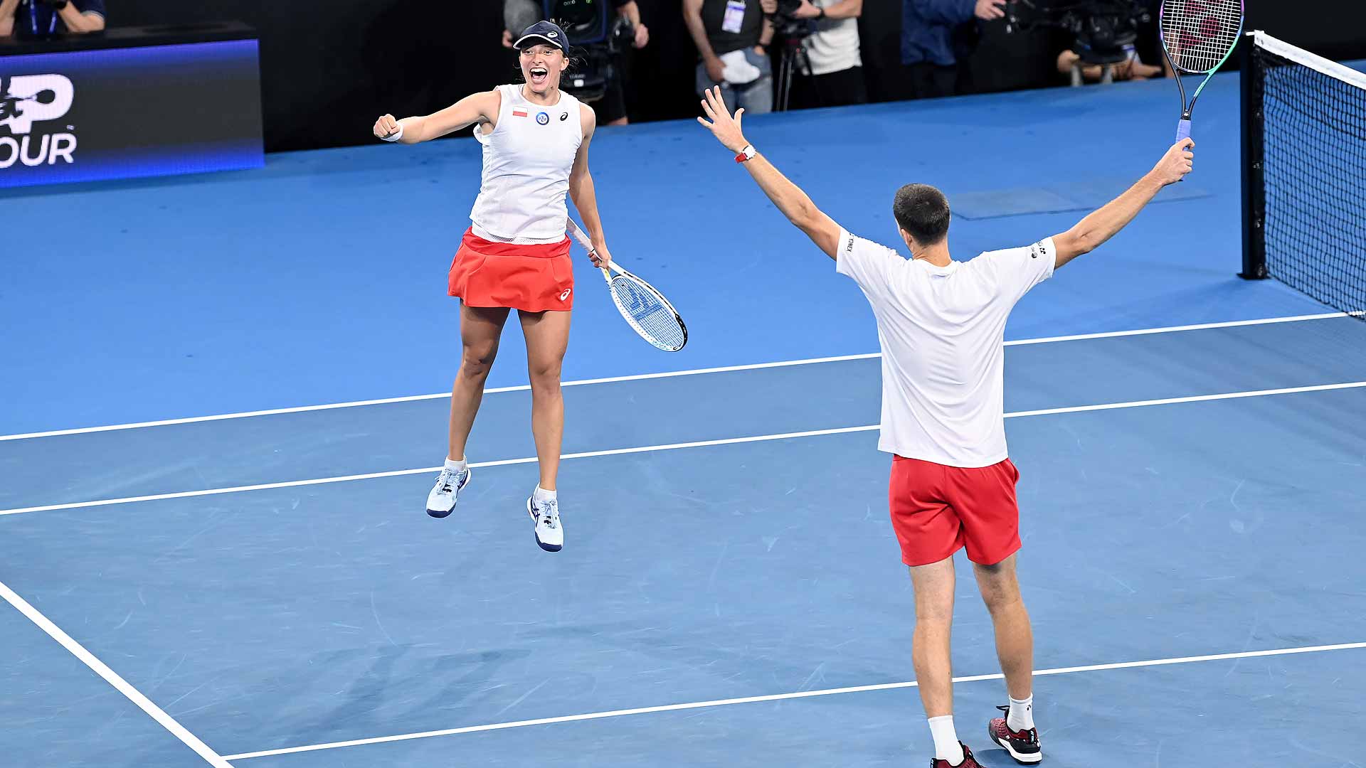Iga Swiatek and Hubert Hurkacz celebrate their deciding mixed doubles win on Wednesday evening in Brisbane.