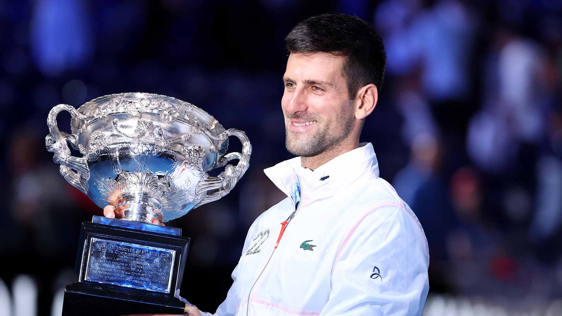 Novak Djokovic celebrates capturing a record-extending 10th Australian Open crown.