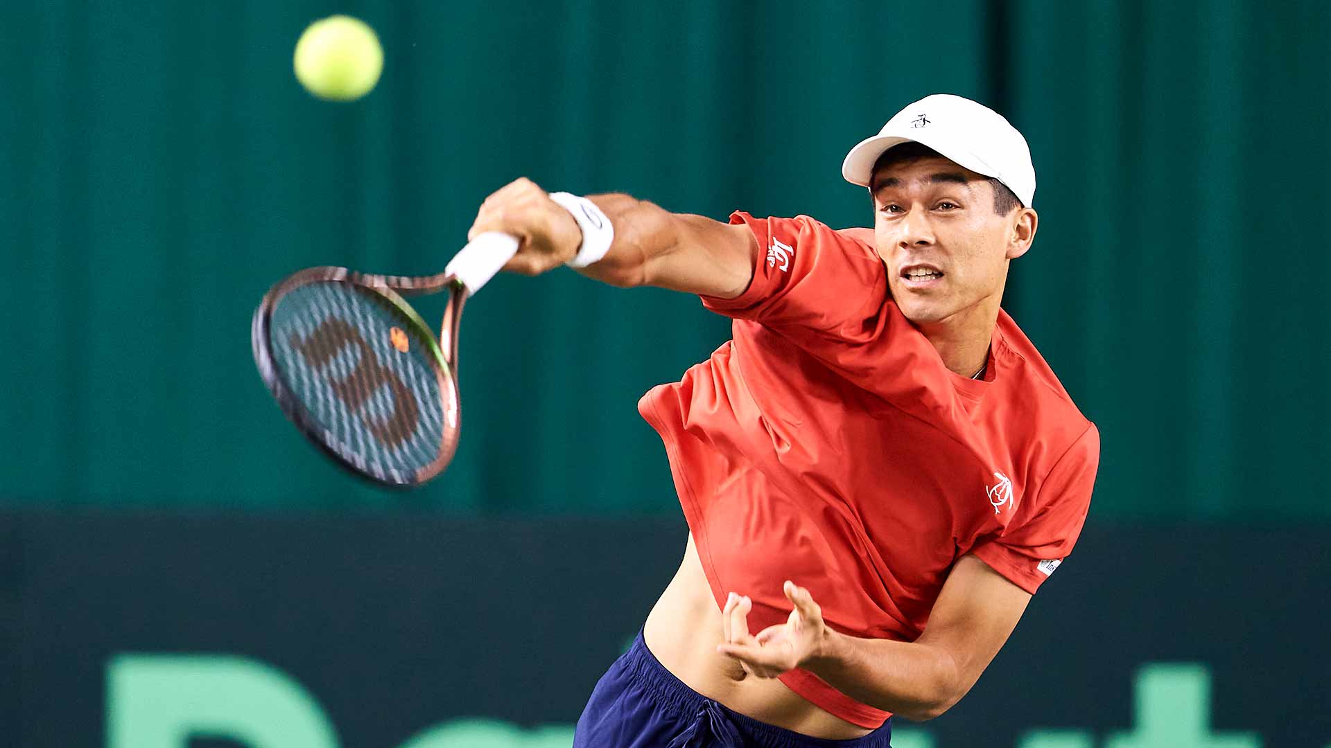 Mackenzie McDonald in action during his victory against Sergey Fomin on Friday in Tashkent.