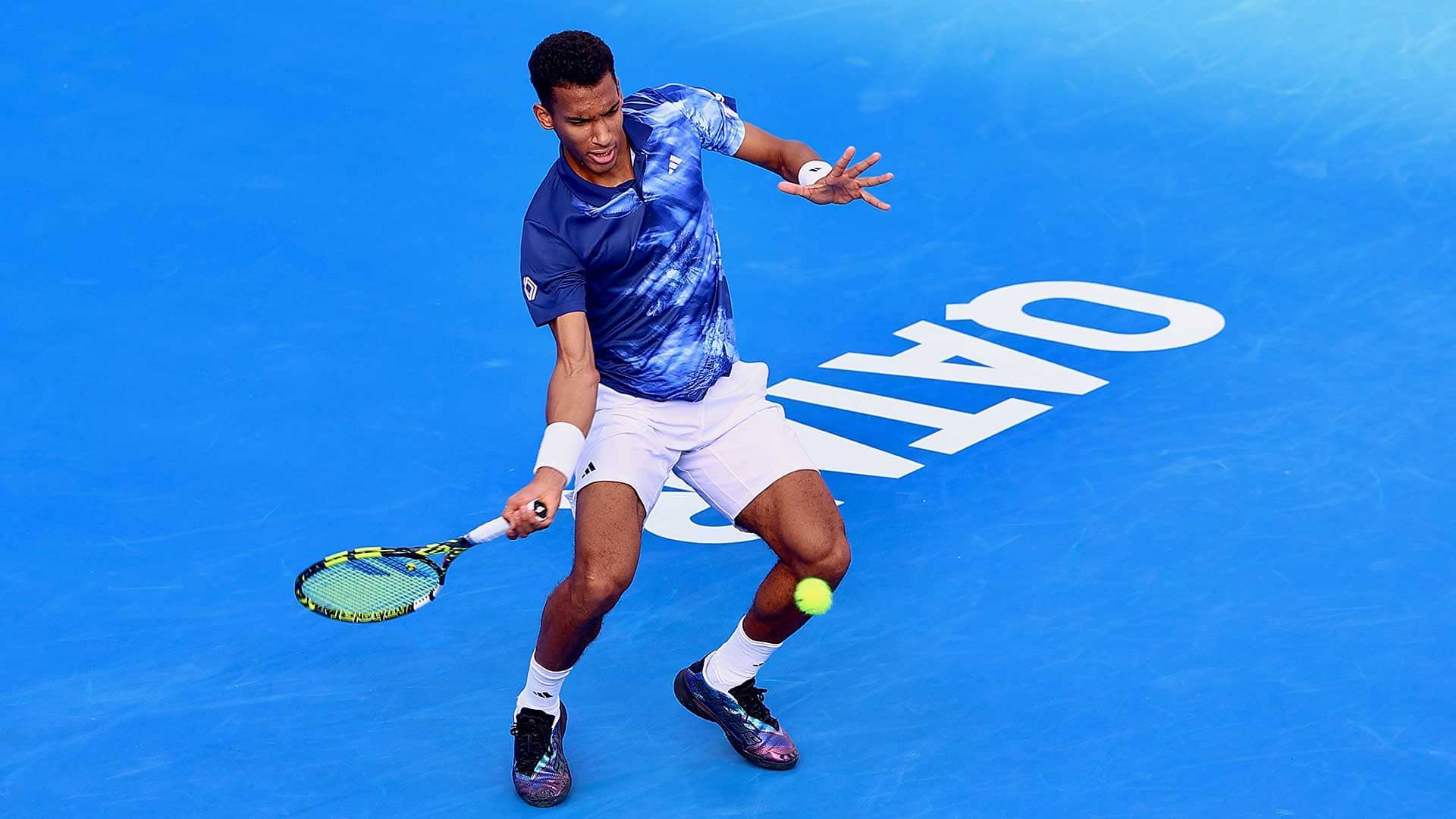 Felix Auger-Aliassime in action against Jason Kubler on Wednesday in Doha.