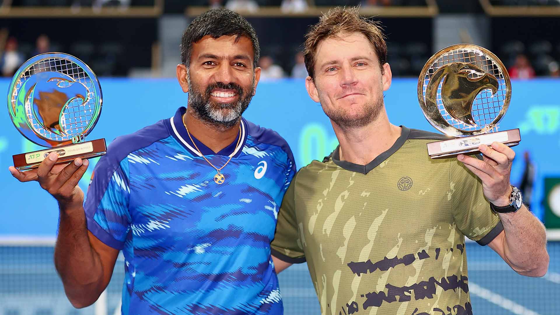 Rohan Bopanna and Matthew Ebden celebrate their maiden ATP Tour title as a team on Friday at the Qatar ExxonMobil Open.