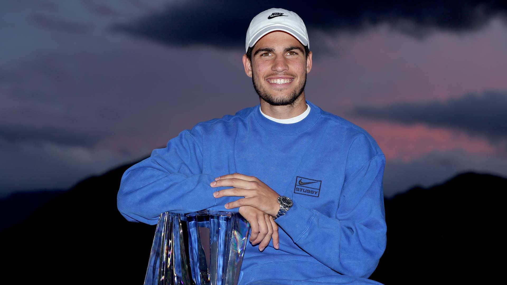 Carlos Alcaraz poses with his maiden Indian Wells trophy.