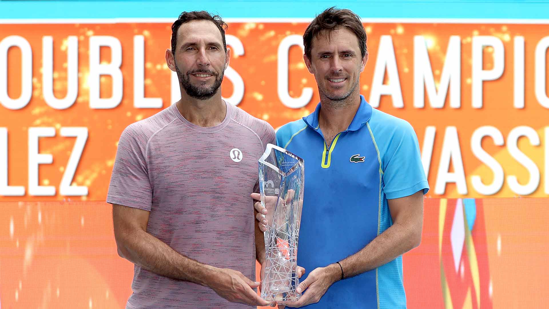Santiago Gonzalez and Edouard Roger-Vasselin lift the Miami Open presented by Itau trophy on Saturday.