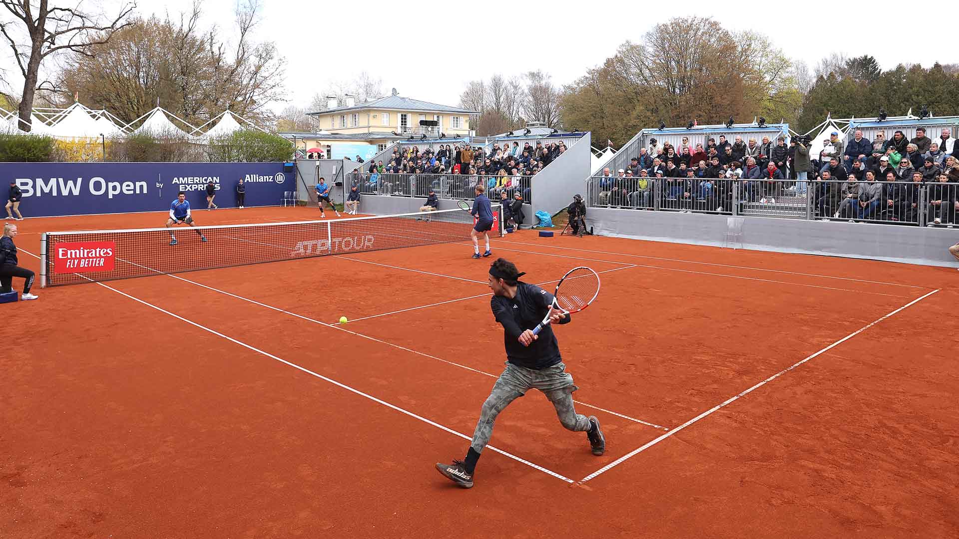 Dominic Thiem plays a backhand in the doubles opening round in Munich.