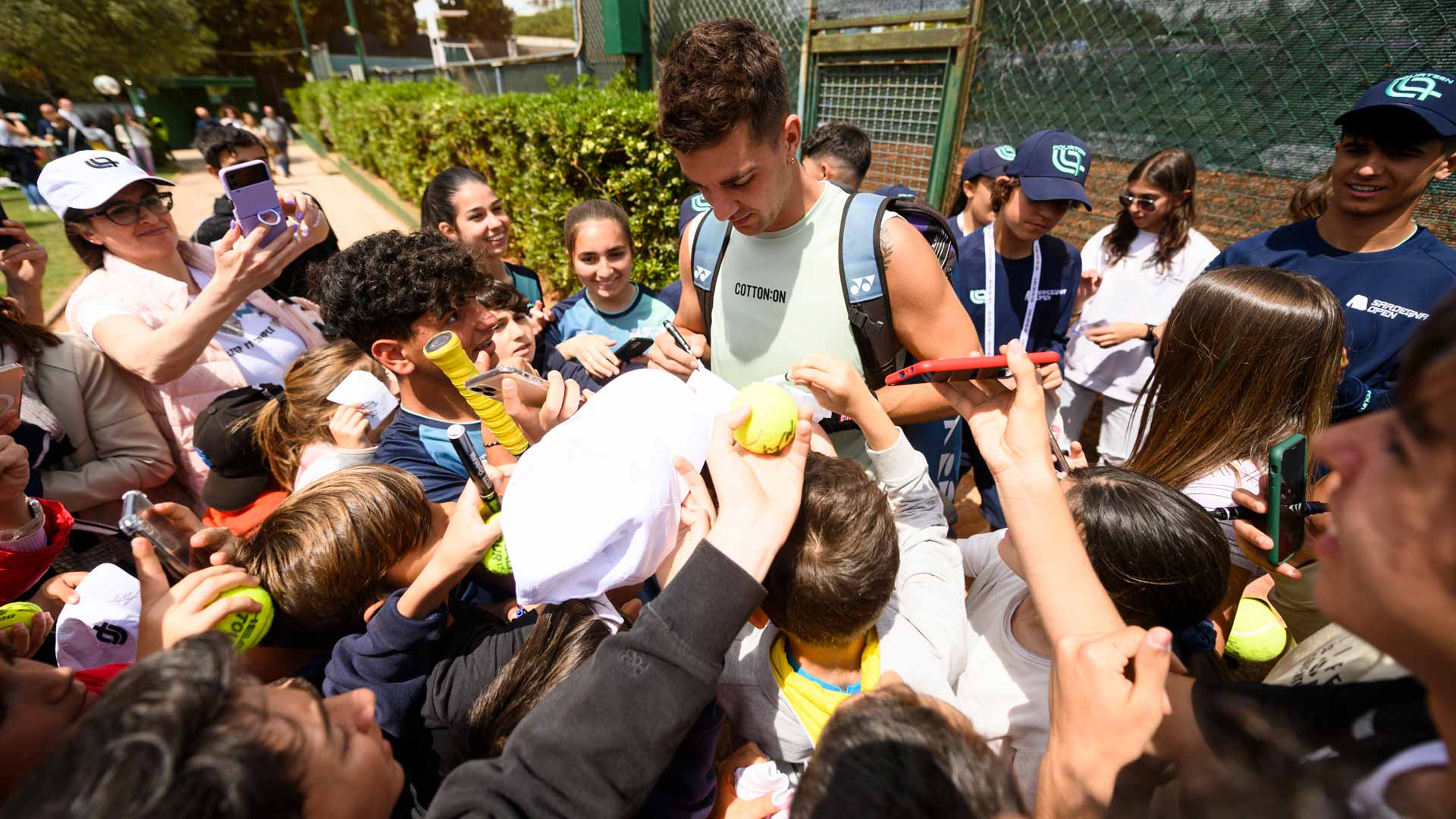 <a href='https://www.atptour.com/en/players/thanasi-kokkinakis/kd46/overview'>Thanasi Kokkinakis</a> greets fans at the <a href='https://www.atptour.com/en/scores/archive/cagliari/2861/2024/results'>Sardegna Open</a> in Cagliari, Italy.