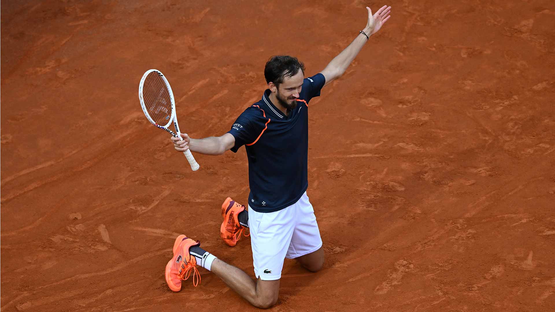 Daniil Medvedev kneels on the Foro Italico clay after claiming his sixth ATP Masters 1000 crown on Sunday in Rome.