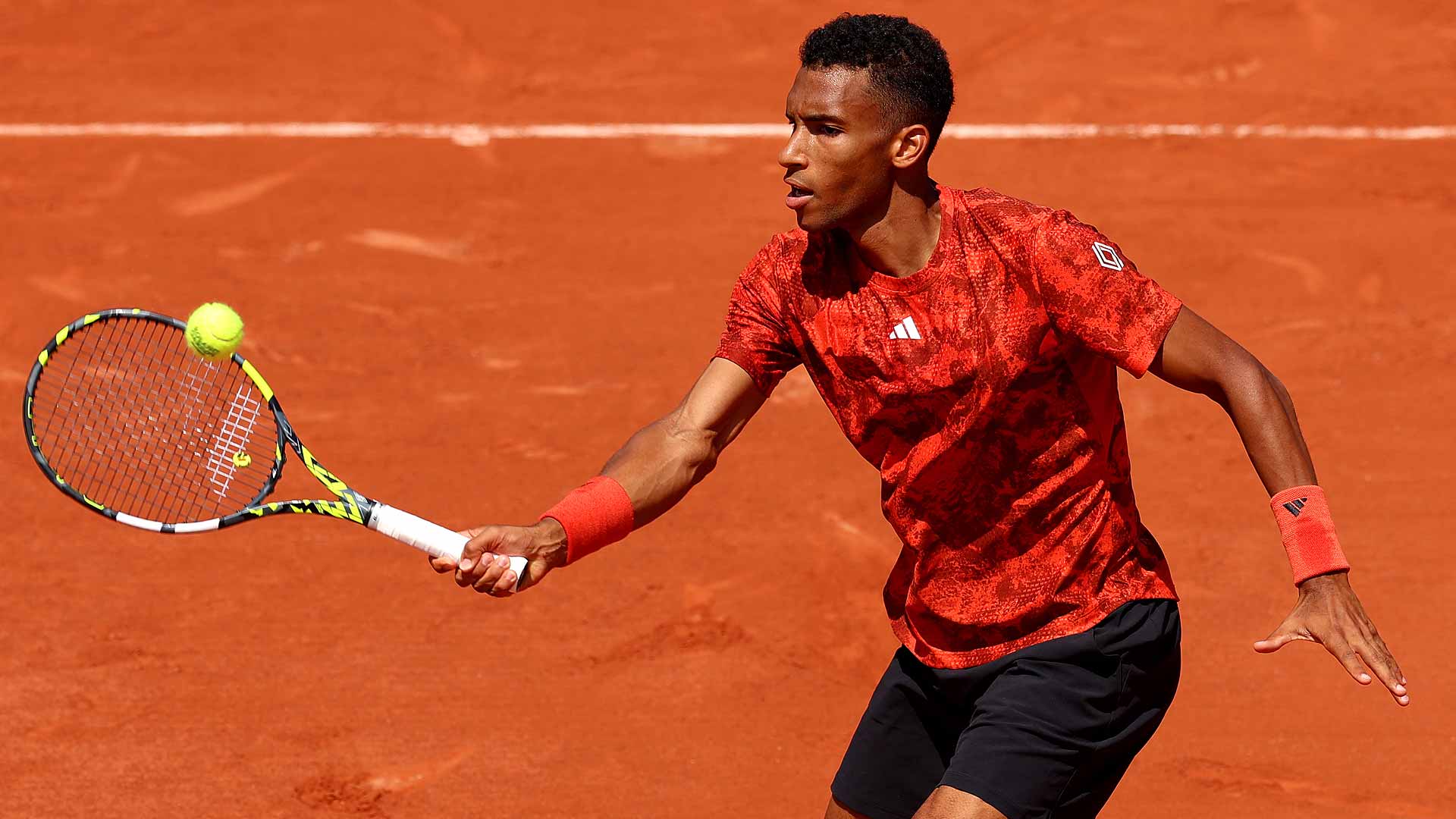 Felix Auger-Aliassime loses in straight sets to Fabio Fognini on Monday at Roland Garros.