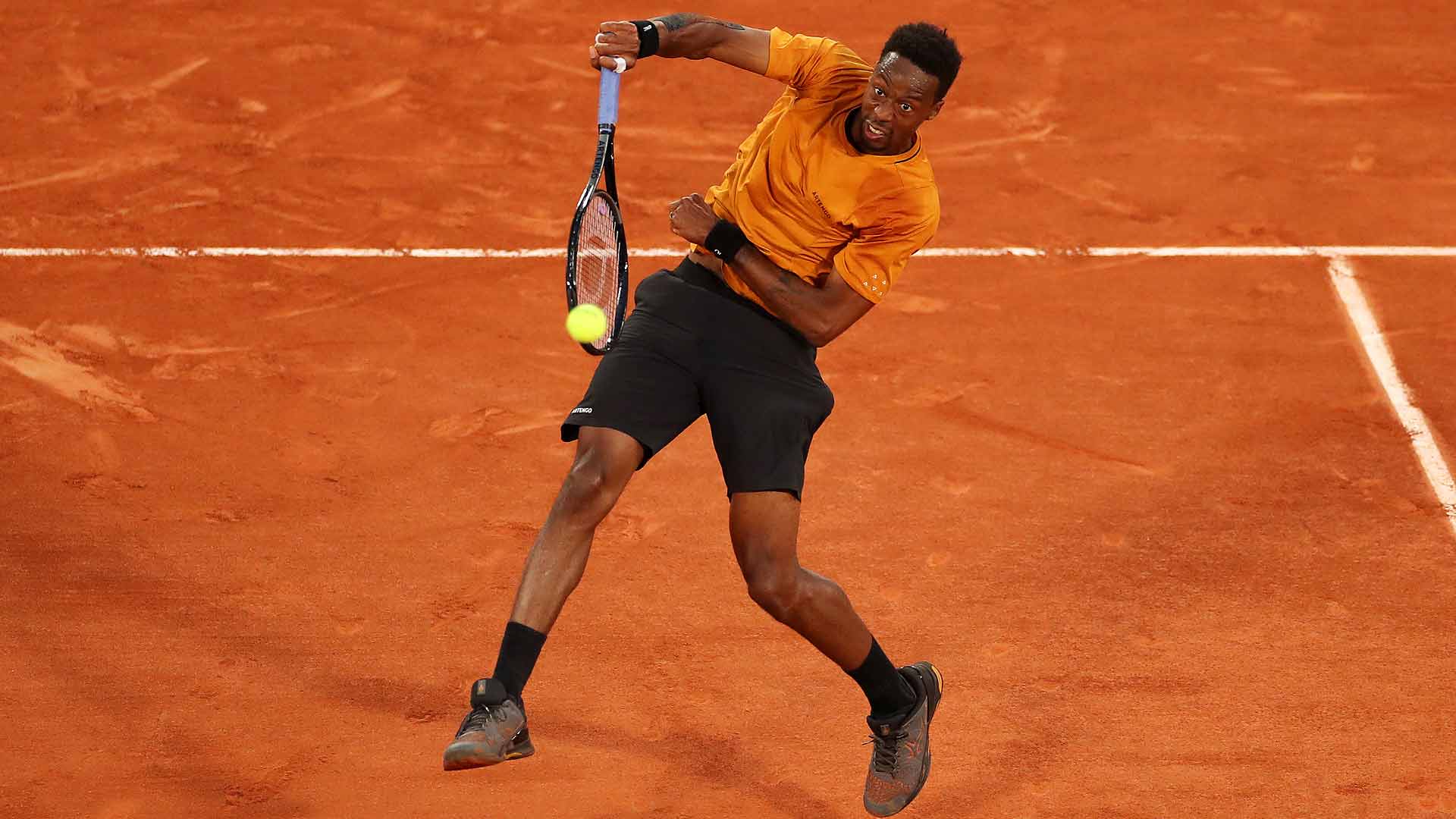 Gael Monfils rallies past Sebastian Baez to advance to the second round at Roland Garros.