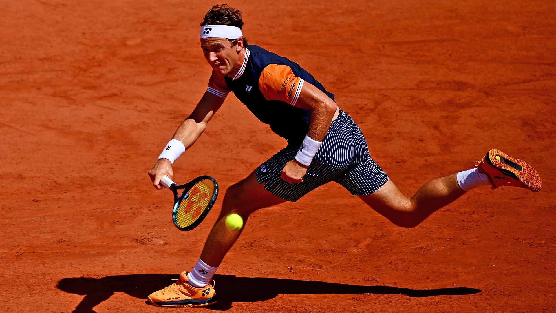 Casper Ruud chases down a ball against Giulio Zeppieri on Thursday at Roland Garros.