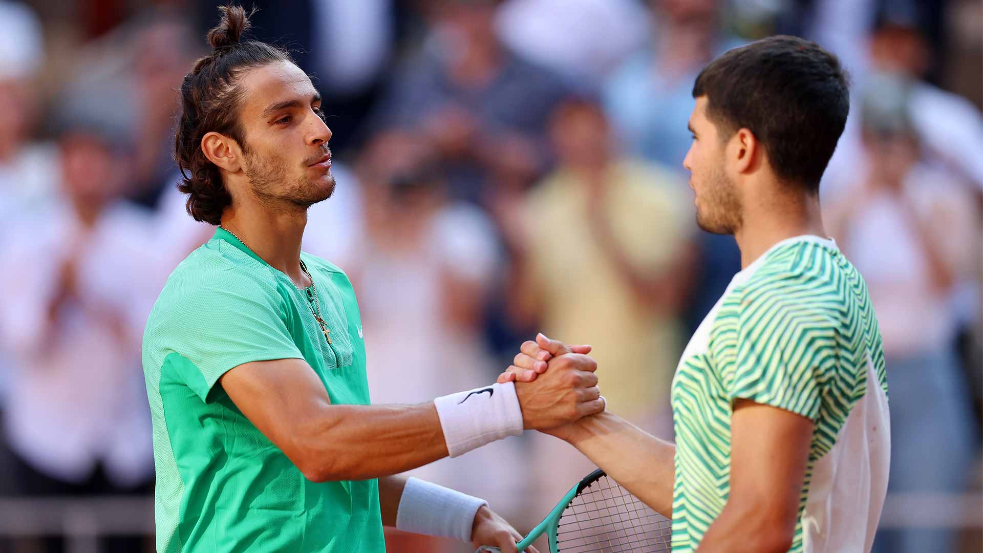 Lorenzo Musetti congratulates Carlos Alcaraz after their fourth-round match at Roland Garros on Sunday.