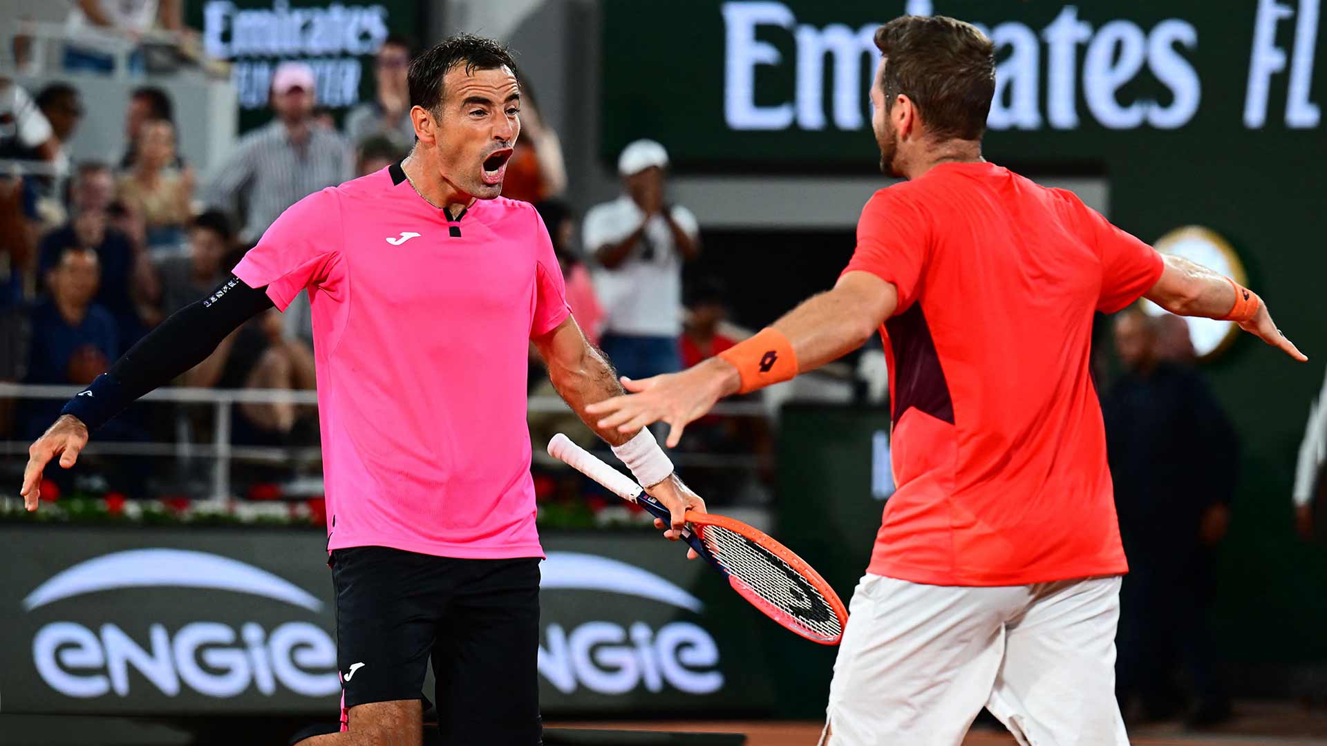 Ivan Dodig and Austin Krajicek celebrate after clinching their maiden major title as a team on Saturday at Roland Garros.