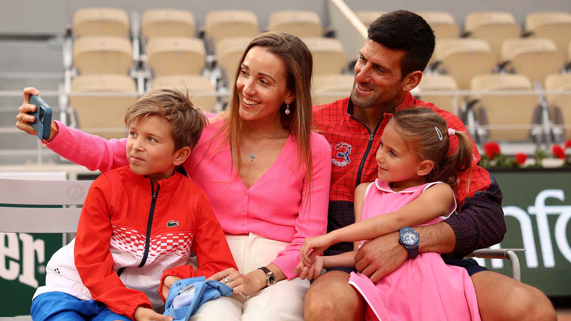 Novak Djokovic celebrates with his family after winning Roland Garros for a third time.