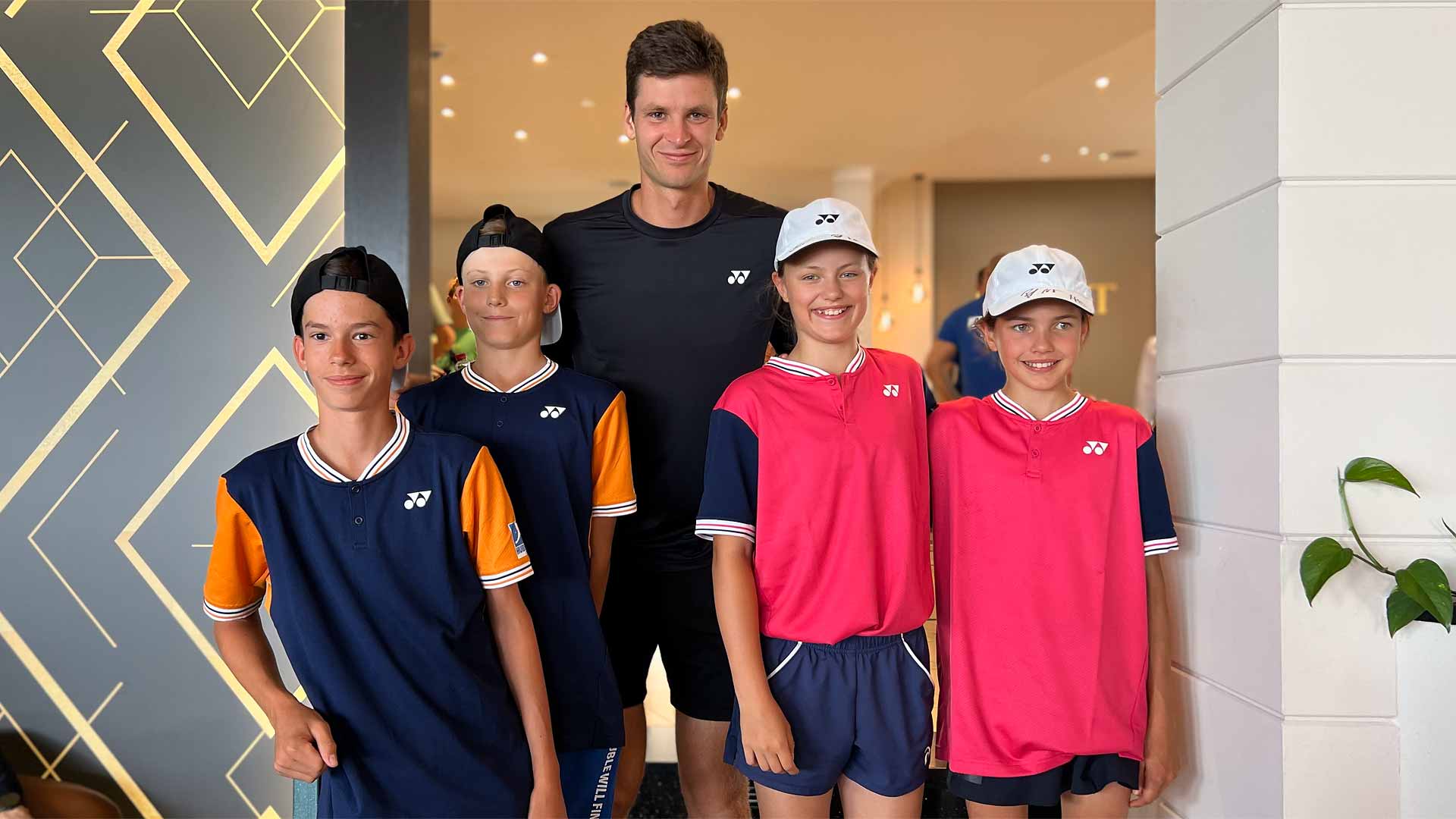 Hubert Hurkacz poses in Halle on Monday with some of the winners of the inaugrual 'Hubi Cup'.