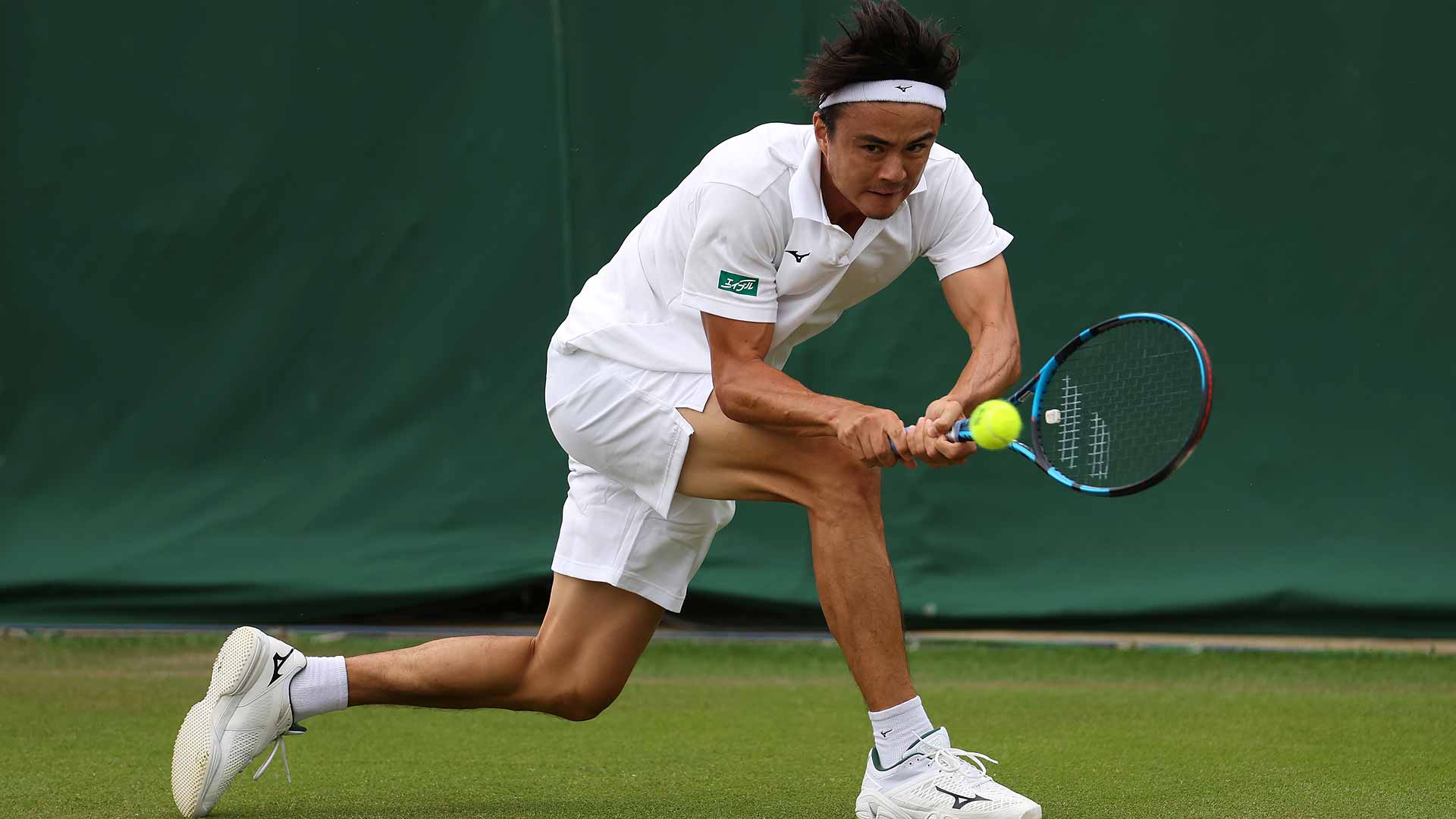 Taro Daniel advances to the final round of qualifying at Wimbledon with a straight-sets victory over Luca Nardi.