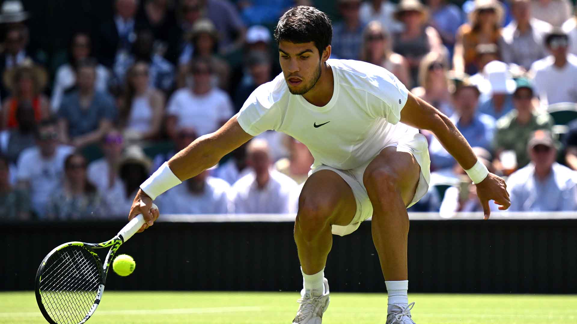 Top seed Carlos Alcaraz in action on Friday at Wimbledon.
