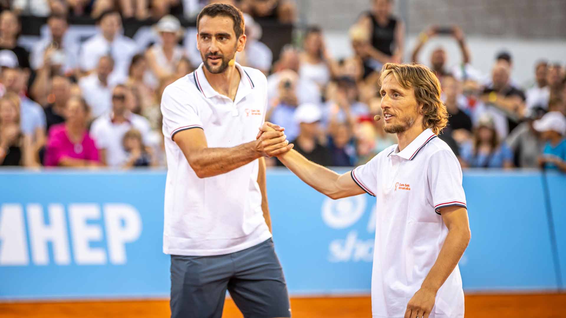 Marin Cilic celebrates a point with football star Luka Modric at Game, Set, Croatia.