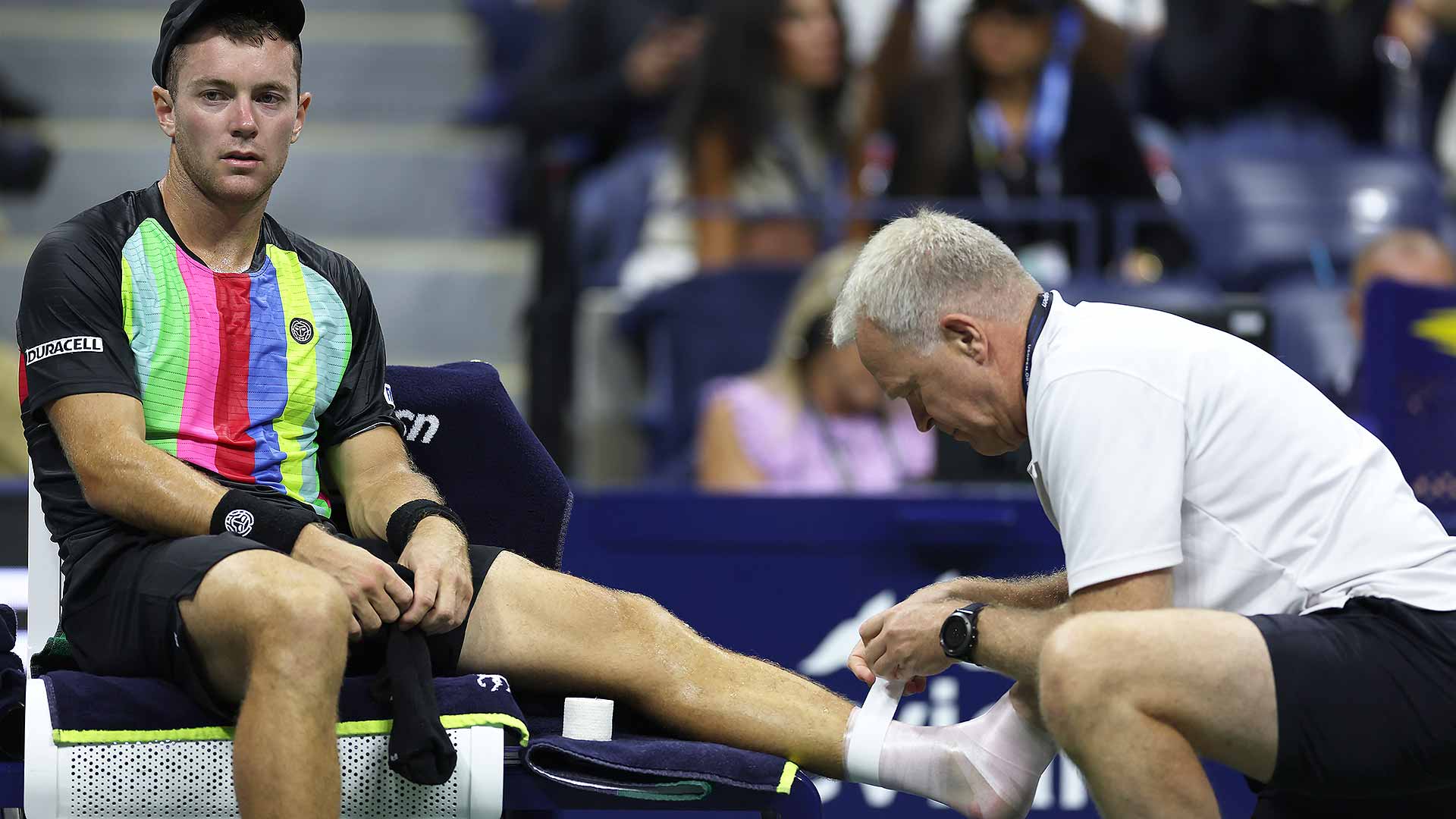 <a href='https://www.atptour.com/en/players/dominik-koepfer/ke73/overview'>Dominik Koepfer</a> receives treatment in the first game from ATP physio Per Bastholt.