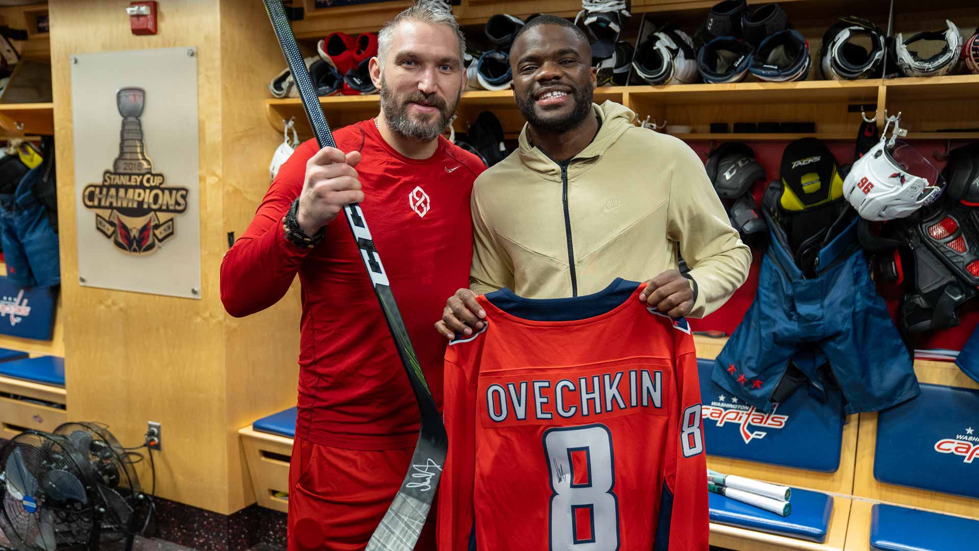Frances Tiafoe poses with NHL legend Alex Ovechkin of the Washington Capitals.