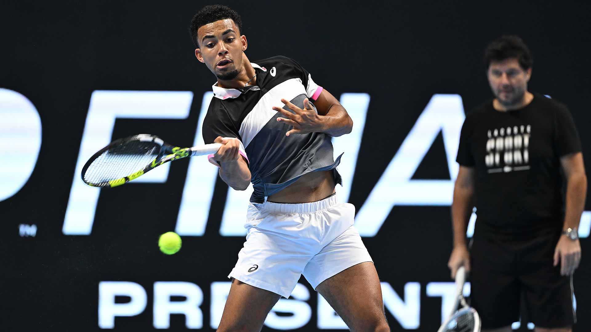 Arthur Fils breaks in centre court at the NextGen ATP Finals presented by NEOM.