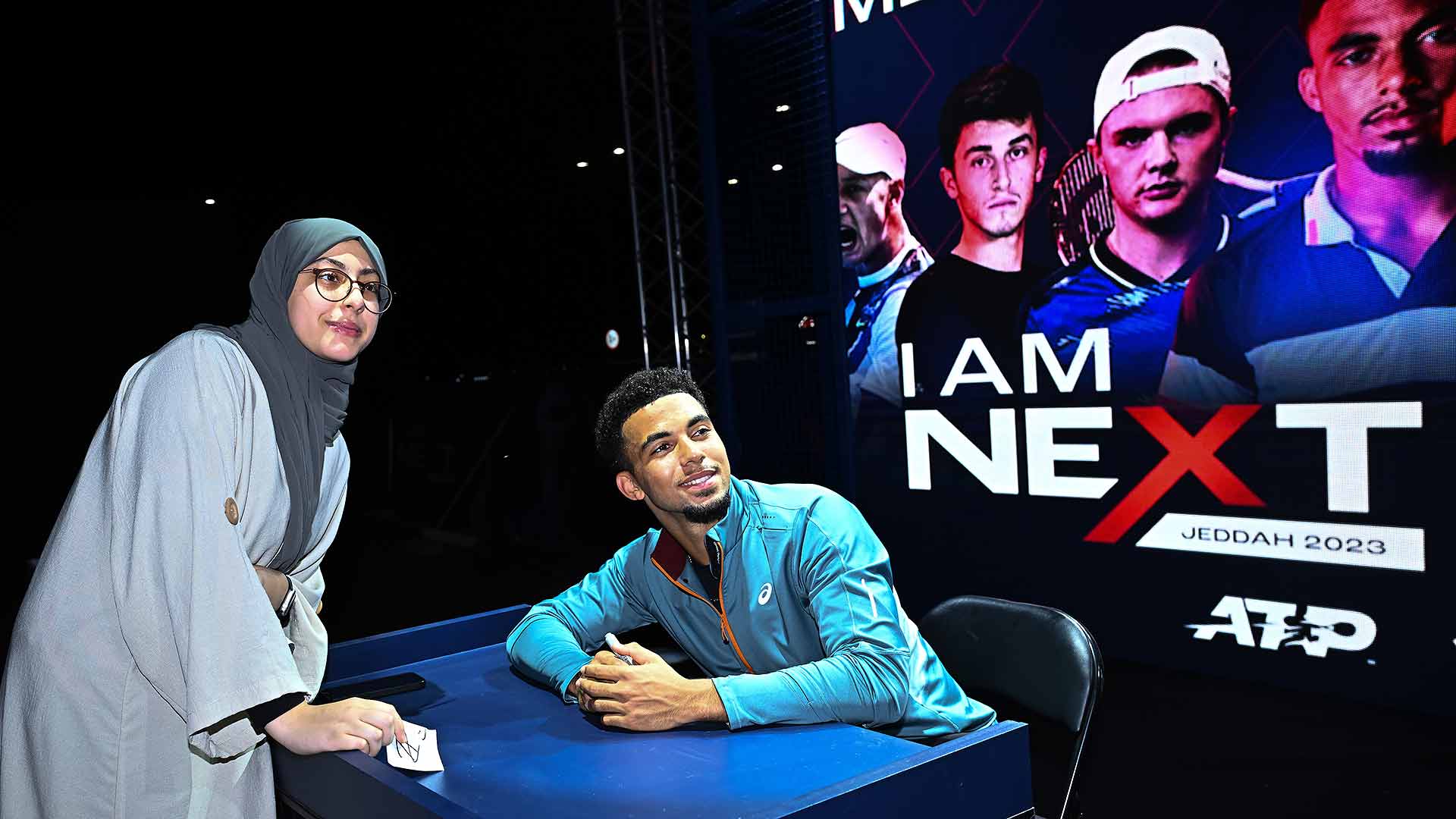 <a href='https://www.atptour.com/en/players/arthur-fils/f0f1/overview'>Arthur Fils</a> with a young Saudi tennis fan at the Fan Zone at the Next Gen ATP Finals presented by NEOM in Jeddah.