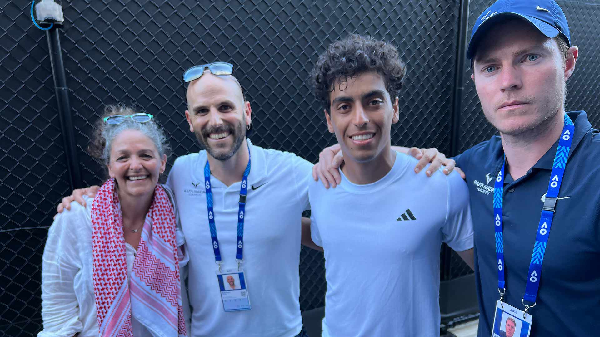 Abdullah Shelbayh celebrates his second-round qualifying win with his team.