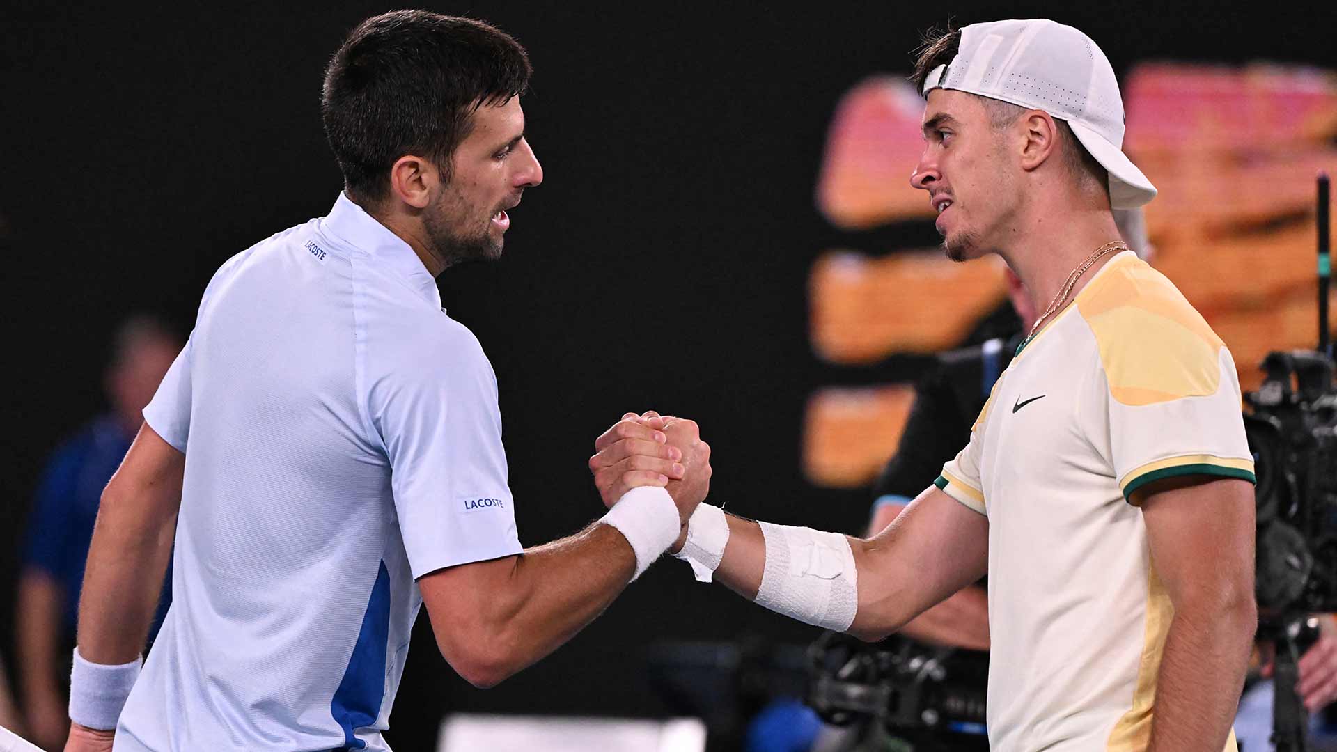 Novak Djokovic greets Dino Prizmic at the net after the pair's Australian Open clash.