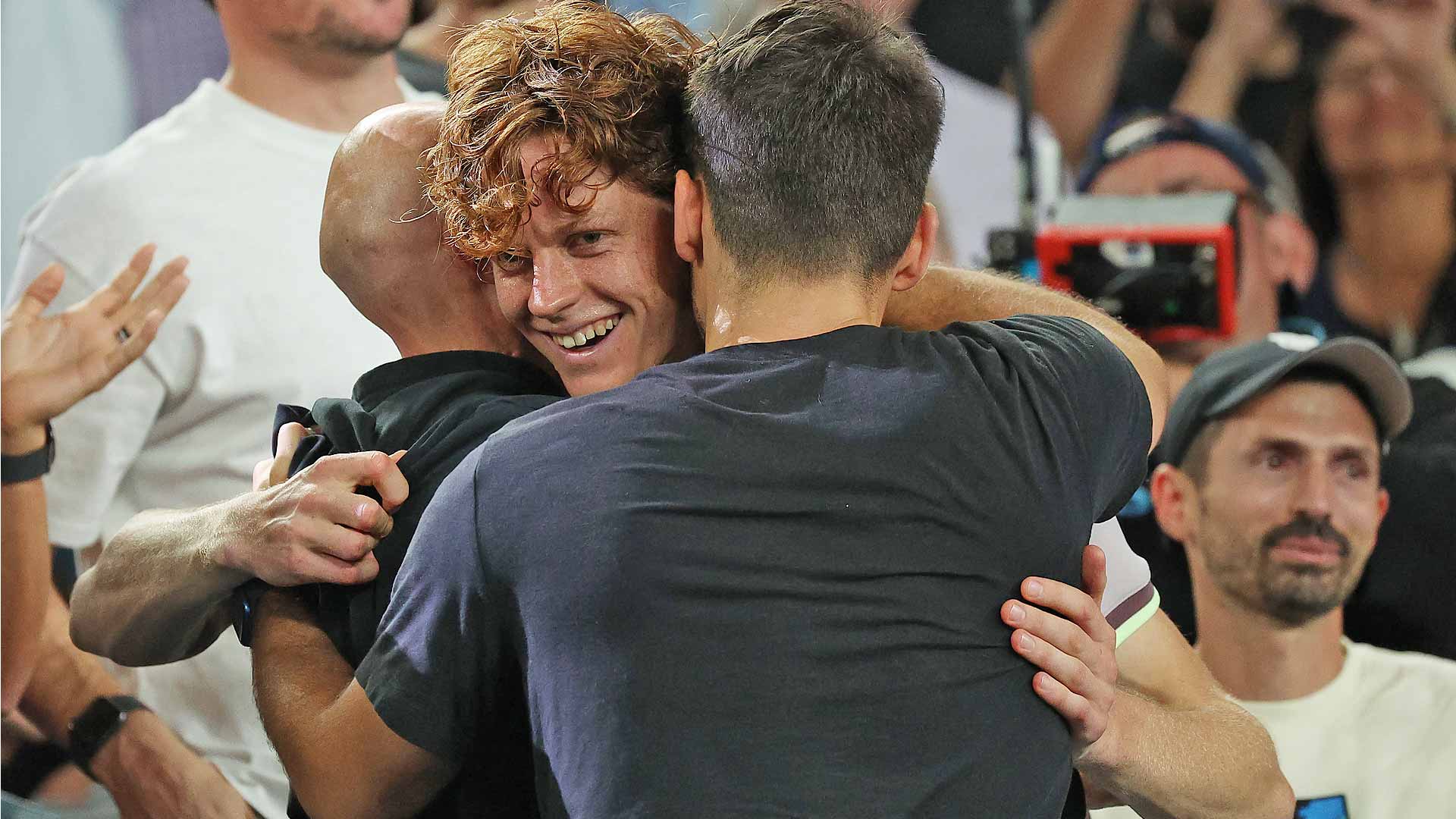 Jannik Sinner celebrates his Australian Open title with his team.