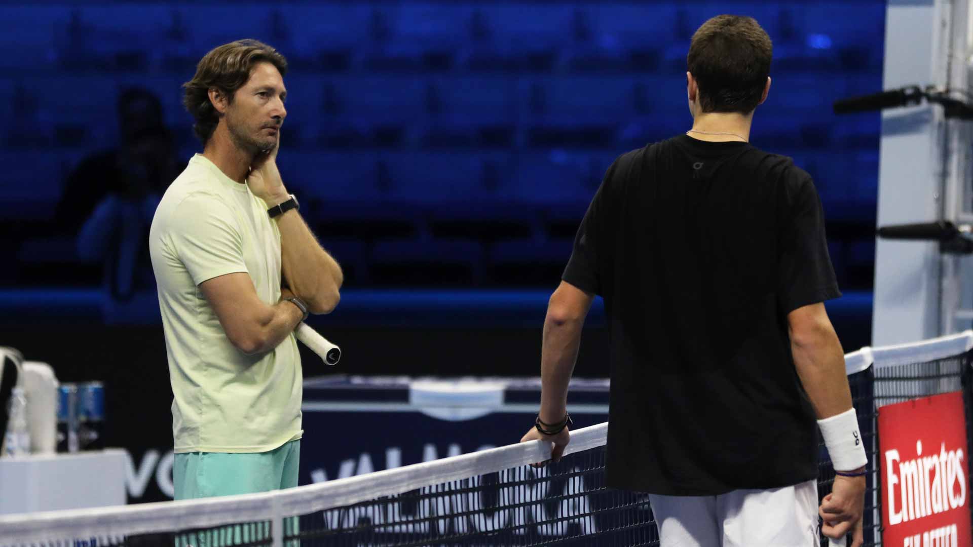 <a href='https://www.atptour.com/en/players/juan-carlos-ferrero/f316/overview'>Juan Carlos Ferrero</a> chats with <a href='https://www.atptour.com/en/players/joao-fonseca/f0fv/overview'>Joao Fonseca</a> during a break in training at the 2023 <a href='https://www.atptour.com/en/tournaments/nitto-atp-finals/605/overview'>Nitto ATP Finals</a>.