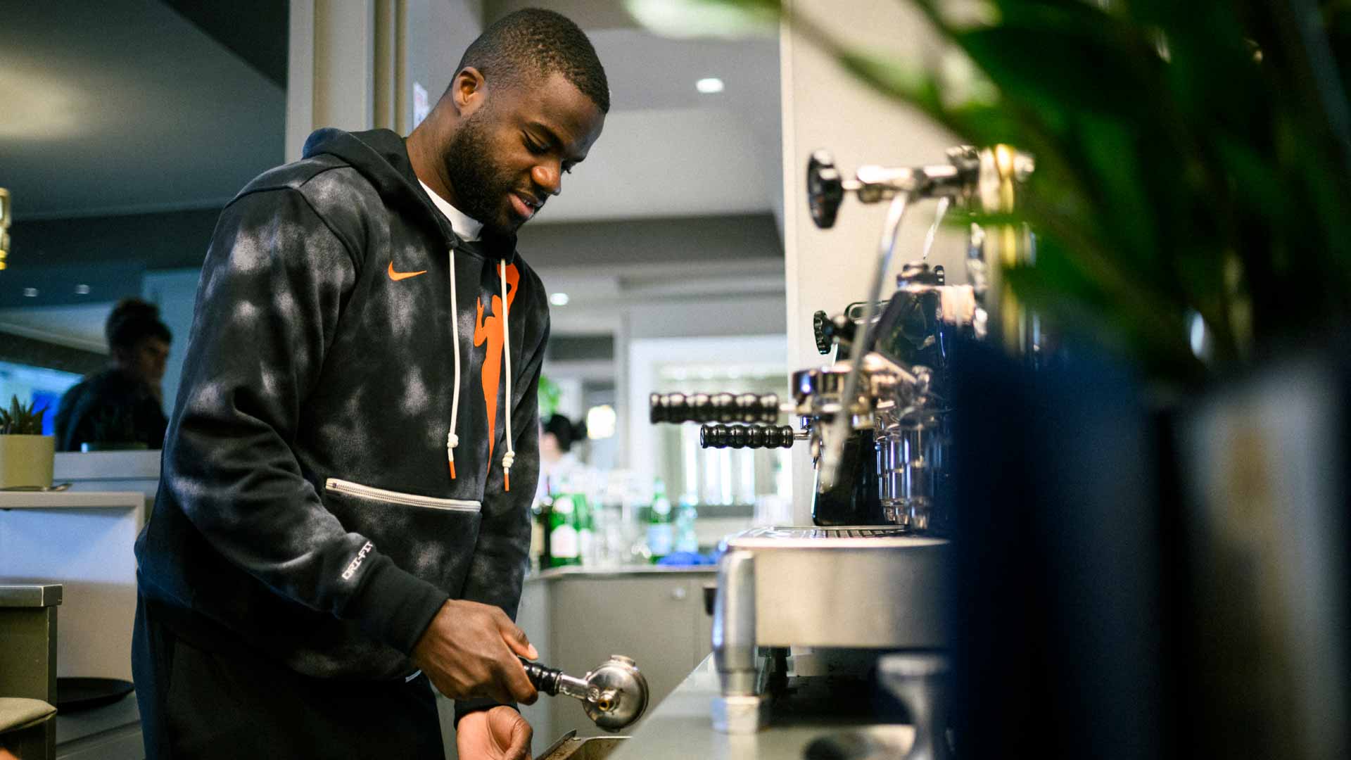 <a href='https://www.atptour.com/en/players/frances-tiafoe/td51/overview'>Frances Tiafoe</a> makes an espresso in Italy.