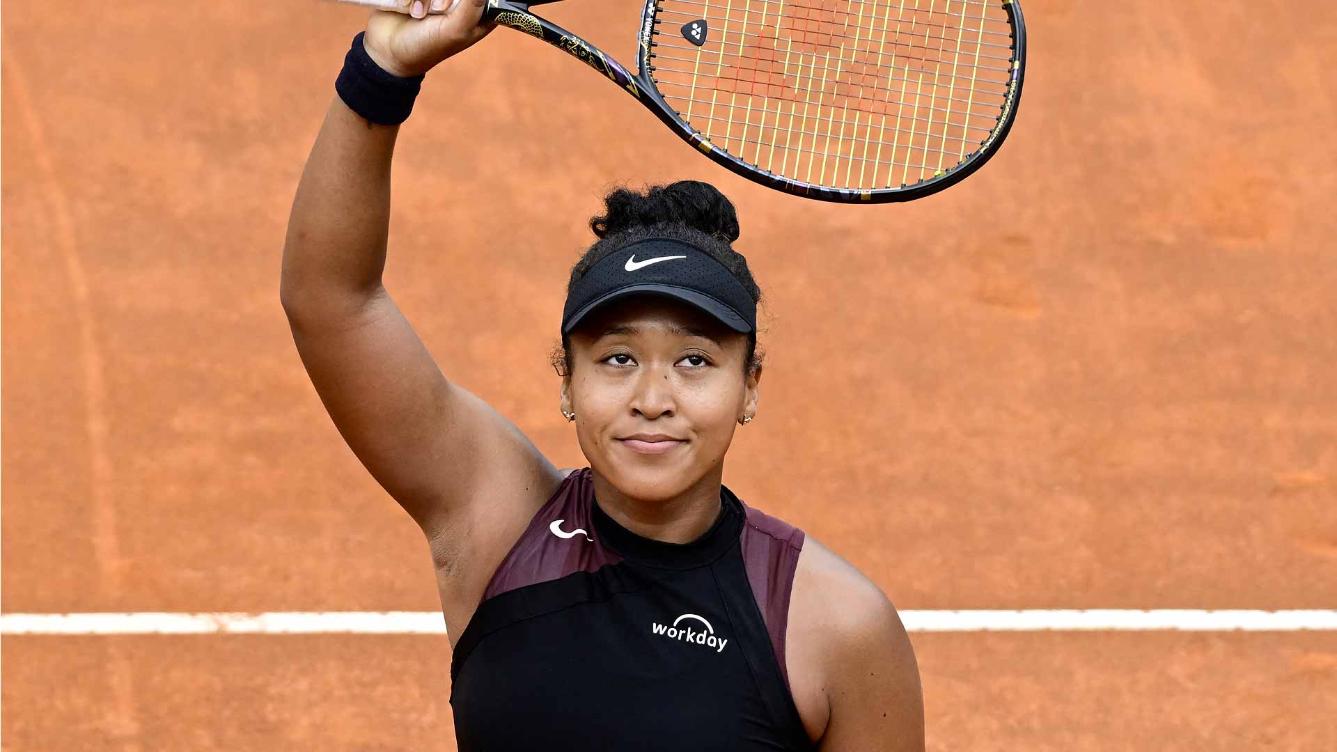 Naomi Osaka celebrates her first-round victory in Rome against Clara Burel.