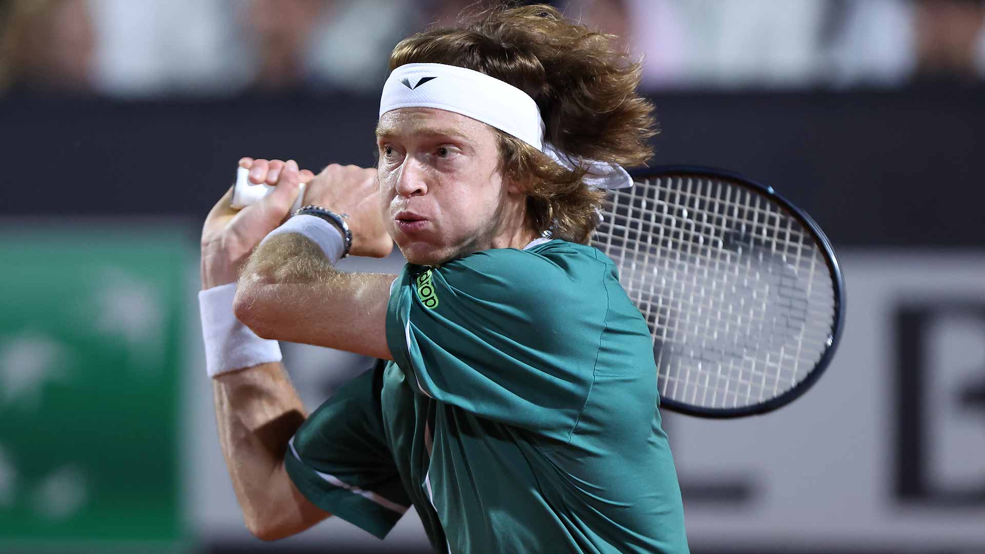 Andrey Rublev defeats Marcos Giron in three sets to reach the third round in Rome.