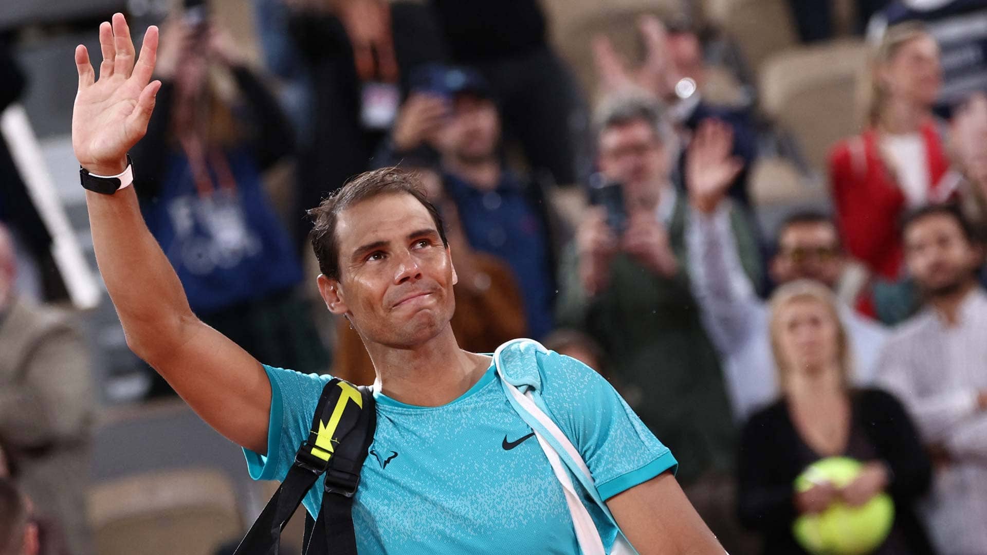 Rafael Nadal waves to the crowd as he exits courts Philippe Chatrier.