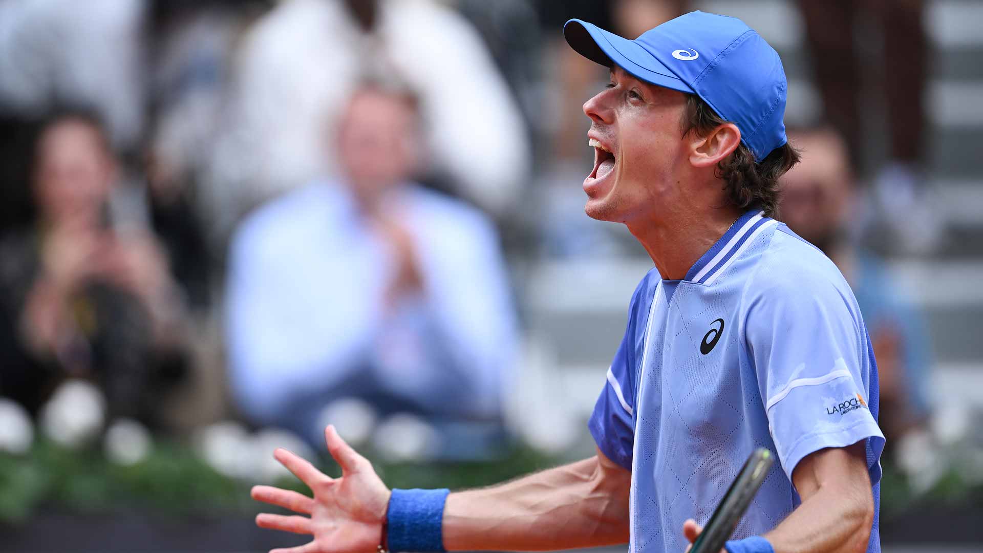 Alex de Minaur celebrates with the crowd after beating Daniil Medvedev on Monday at Roland Garros.