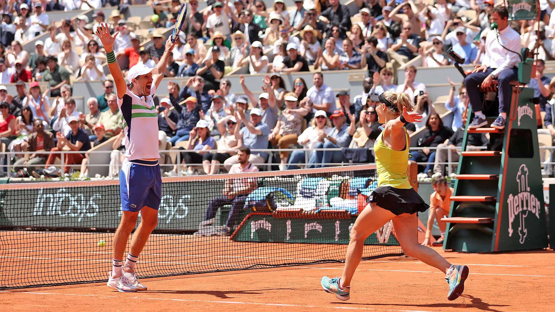 Edouard Roger-Vasselin and Laura Siegemund celebrate after clinching the mixed doubles title at Roland Garros.