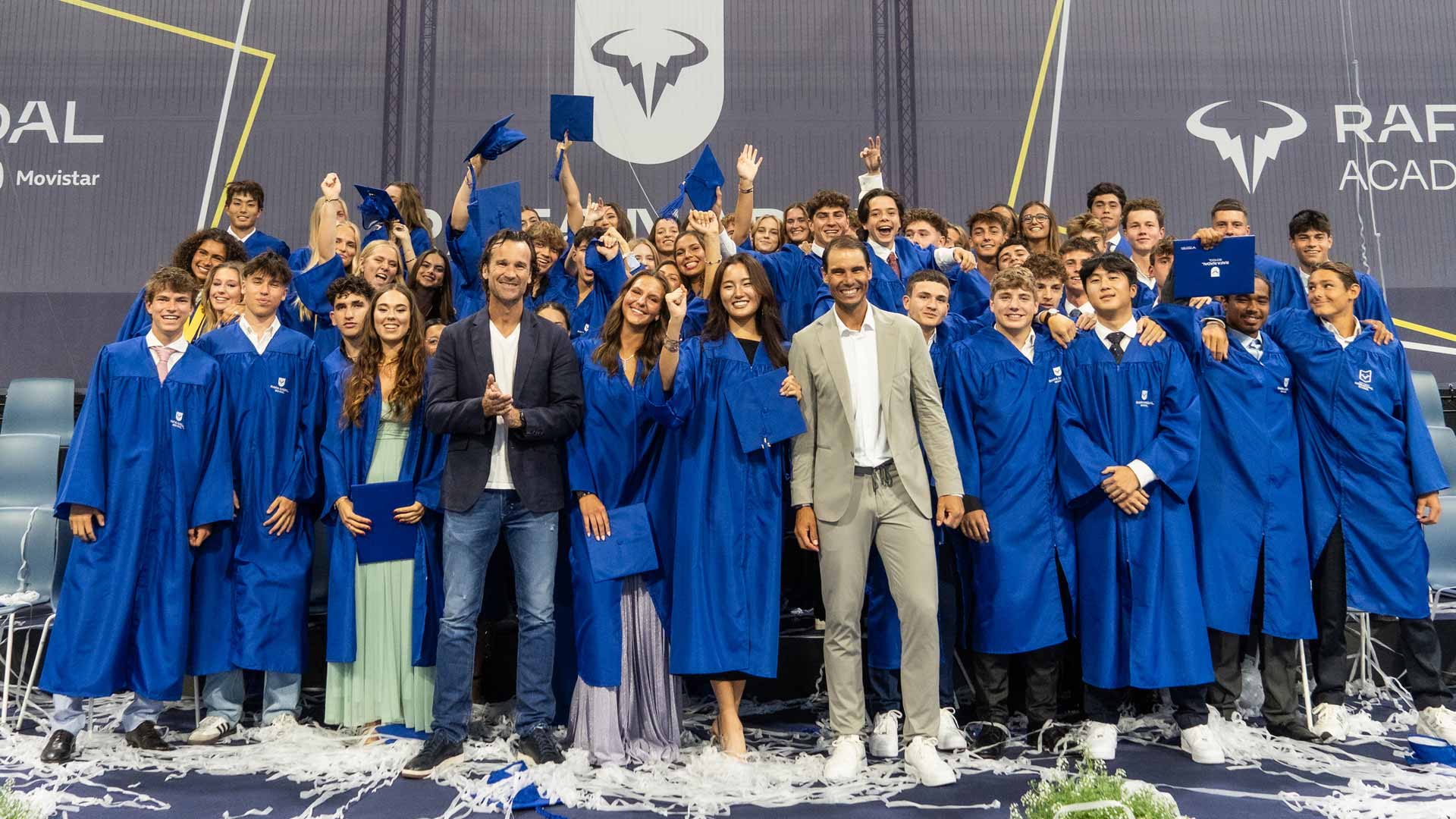 <a href='https://www.atptour.com/en/players/carlos-moya/m605/overview'>Carlos Moya</a> and <a href='https://www.atptour.com/en/players/rafael-nadal/n409/overview'>Rafael Nadal</a> with the Class of 2024 at the Rafa Nadal Academy by Movistar.